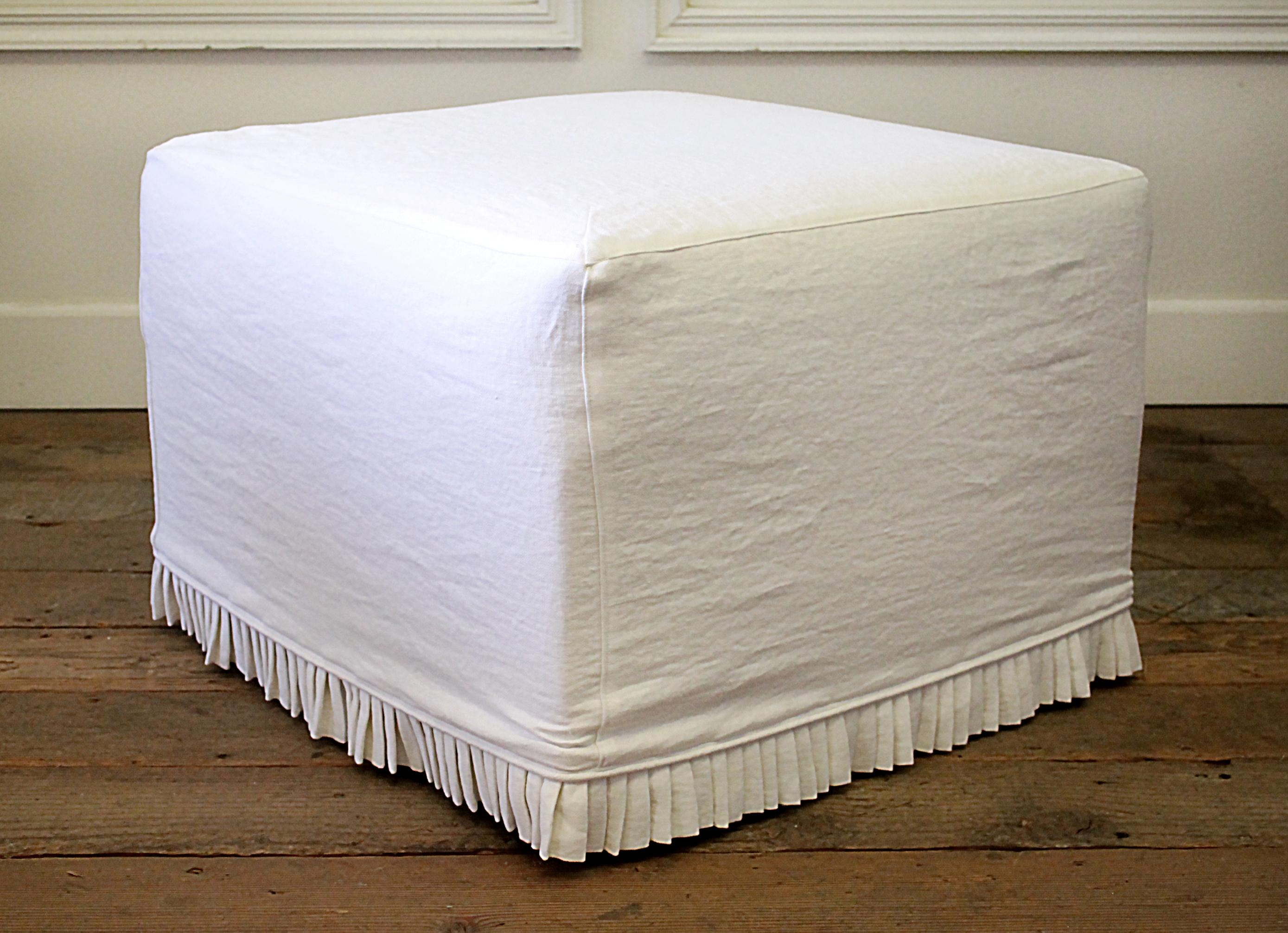 Custom cube Ottoman slip covered in white Belgian Linen with hand pleated ruffle.
Muslin upholstered ottoman, with beautiful white linen slip cover.
We custom made this ottoman with a Belgian linen cover, that can be washed and dried, on low