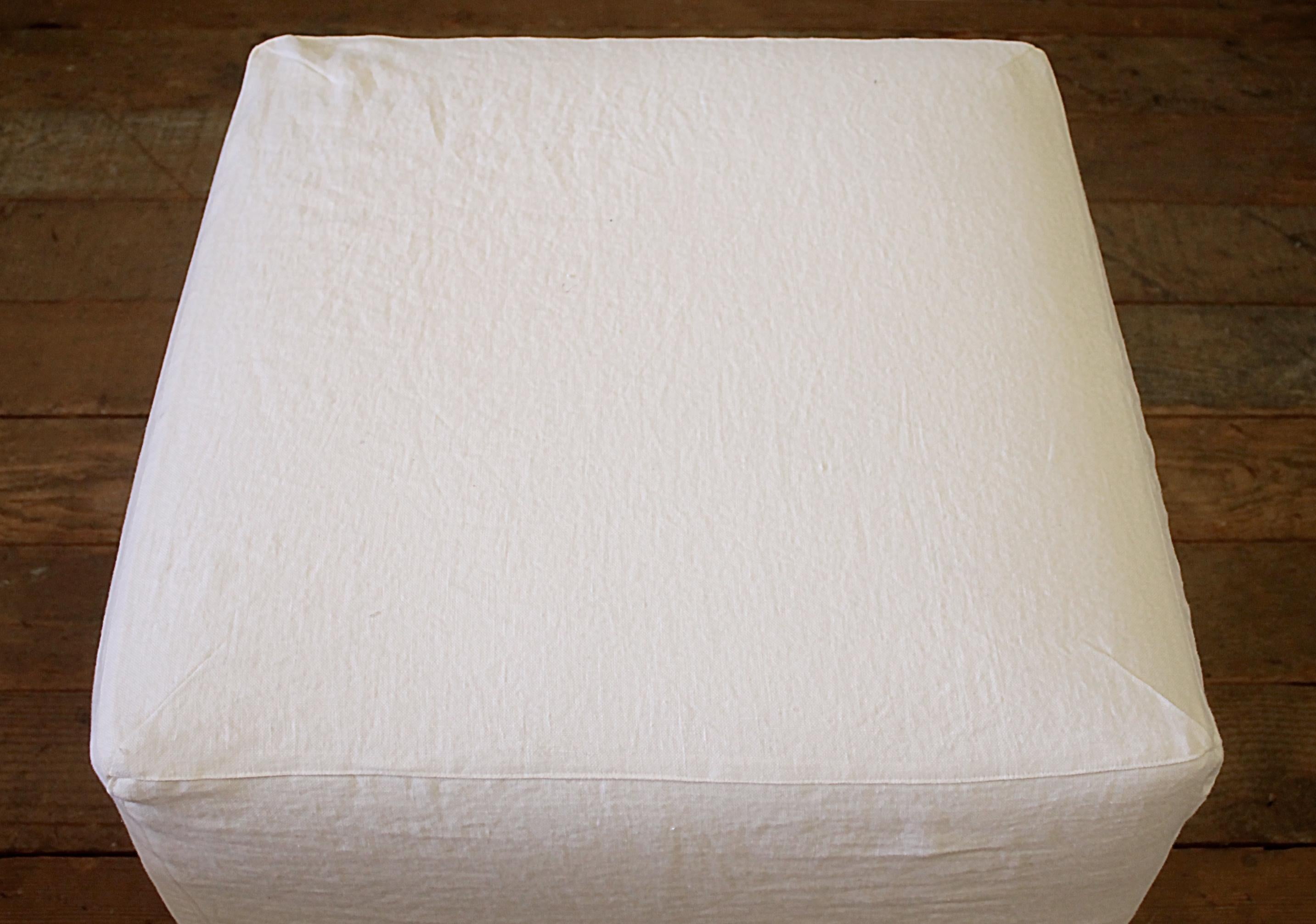 North American Custom Cube Ottoman Slip Covered in White Belgian Linen with Hand Pleated Ruffle
