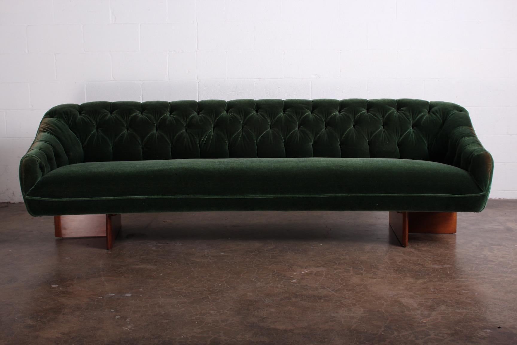 A curved Vladimir Kagan sofa with tufted mohair on walnut bases designed for a Park Ave apartment. The interior was full of Kagan designs including this sofa and matching swivel chairs.
