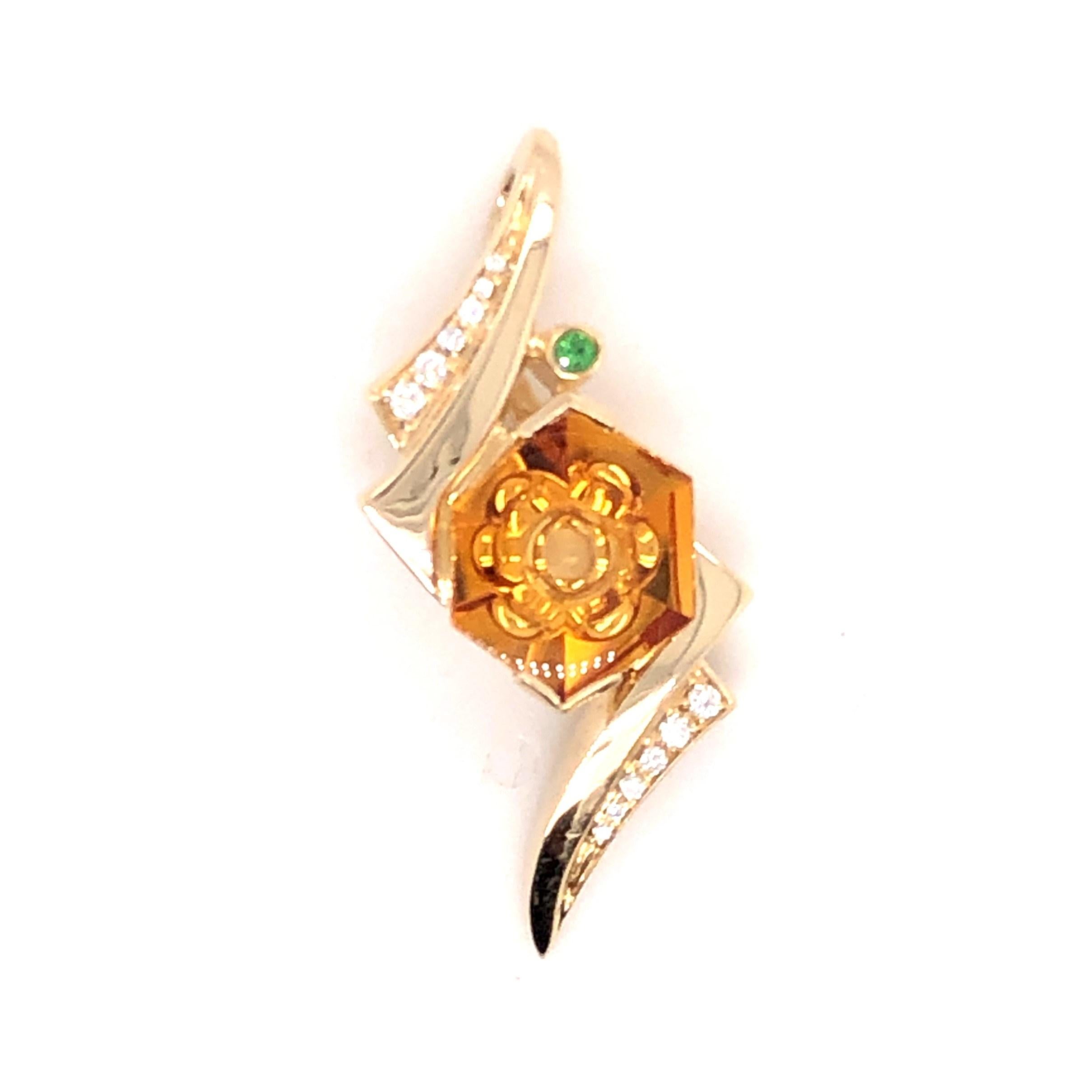 14kt yellow gold Fantasy Cut Citrine and approximately .12tcw H-I color SI1-SI2 clarity diamond and Tasvorite Garnet Pendant.

This striking pendant was custom made from a fantasy cut citrine, most likely in the 1990's when the art of gem cutting