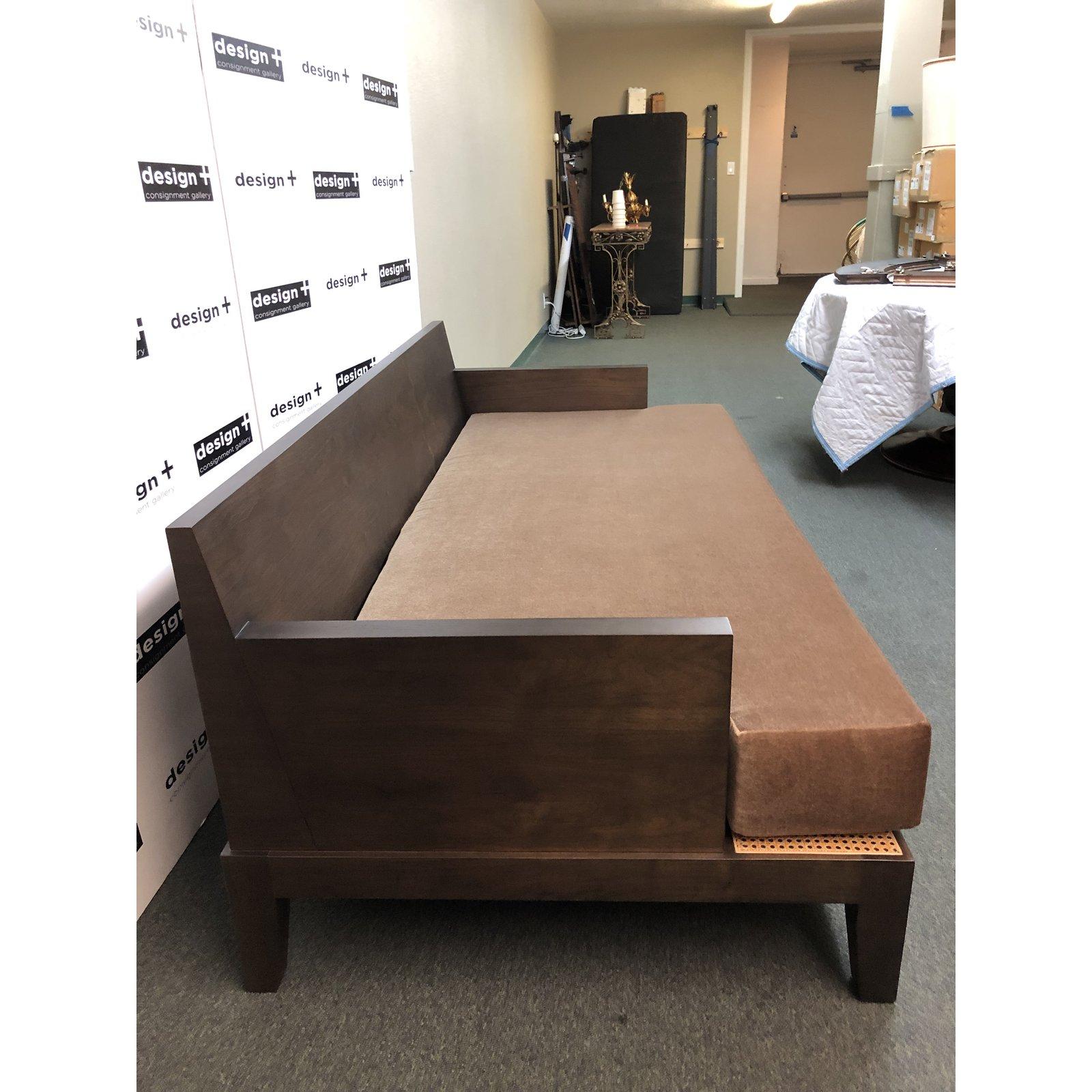 A custom daybed by Bee market. Exquisitely a post heard in Carmel mohair, the espresso stand face features a Contrastingwoven rattan inset. Six coordinating down filled decor pillows are included, as shown.
