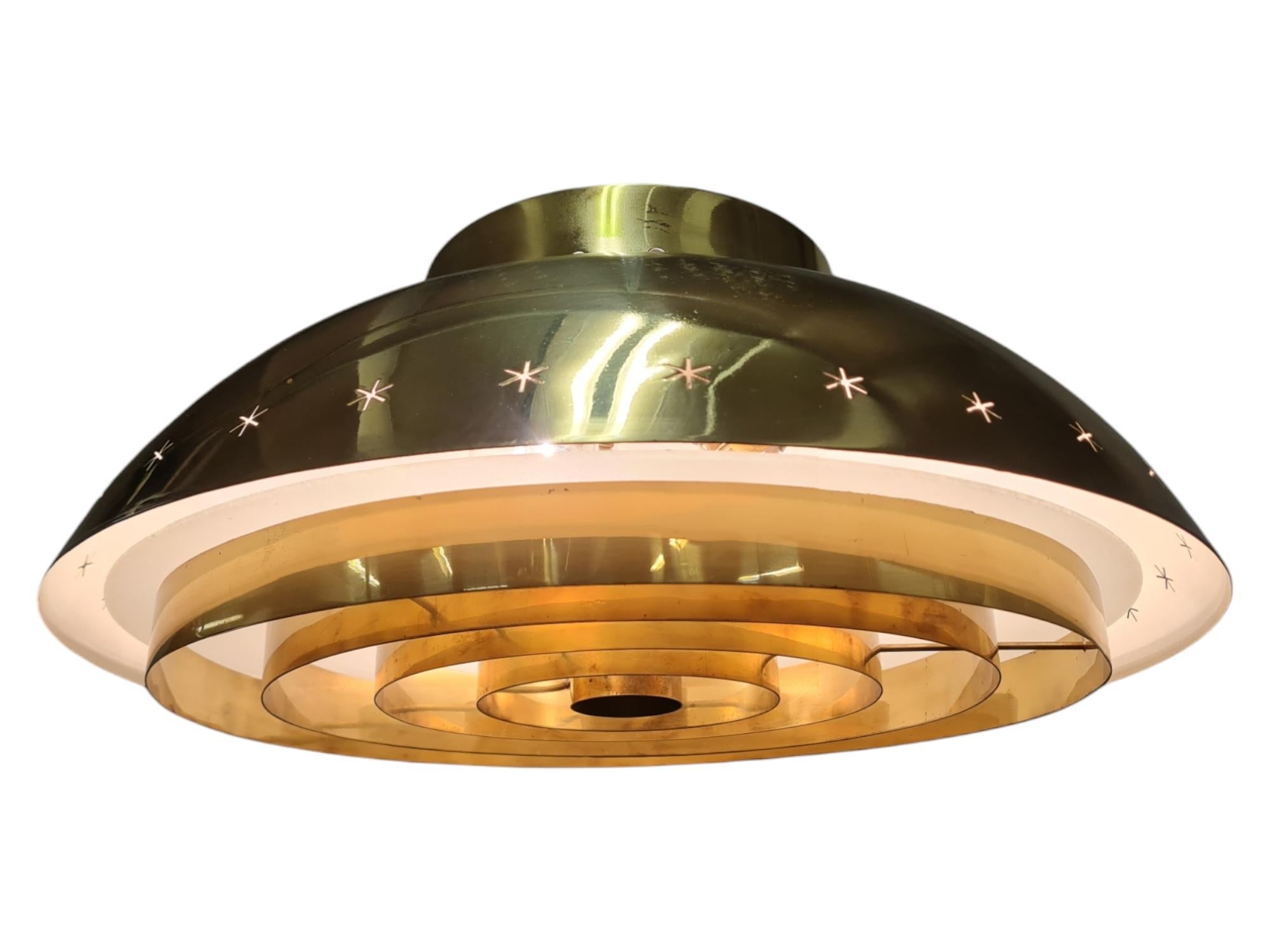 An exceptionally rare custom-made Paavo Tynell ceiling lamp with exclusive provenance. This lamp is one of only two of this most likely unique model, commissioned and designed for the Akaa Parish in the Toijala region of Middle Finland. The lamps