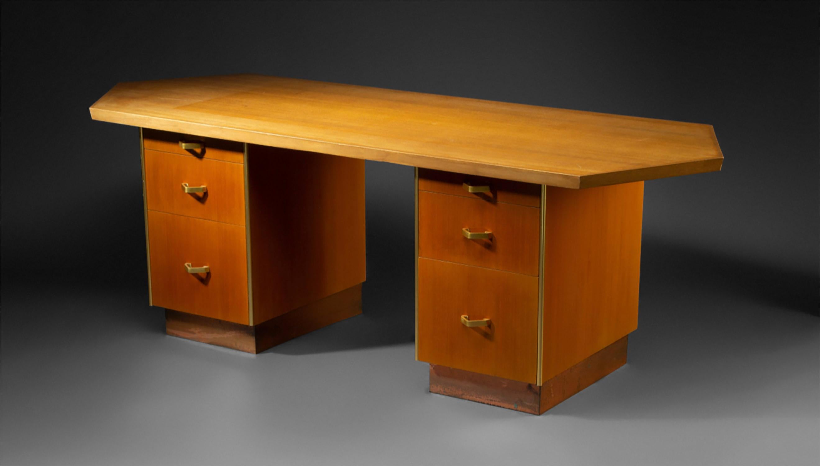 This is a unique studio produced desk designed by Frank Lloyd Wright for the Price Tower in Bartlesville Oklahoma. This particular example was commissioned by the owner of the tower, Carolyn Price, for her personal office. The desks in Price Tower