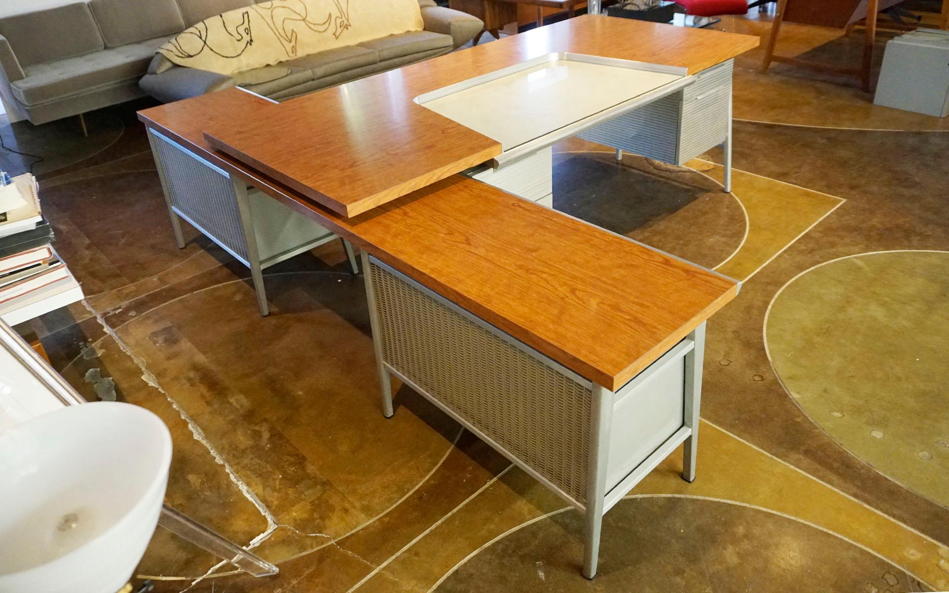 This is a one of a kind, custom designed partners desk with credenza by Gordon Bunshaft for the General Fireproofing Company, also know as GF and GoodForm. The best looking wood laminate top we've ever seen with a white leather covered work area