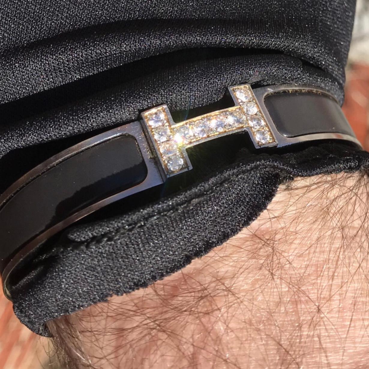 Custom Diamond Hermes Clic H Enamel Bracelet GM size complete with original box.

An original Hermes Clic H bracelet in black and silver color is customized hand-set with approx. 1.25 carats of natural genuine earth-mined SI Diamonds. The diamonds