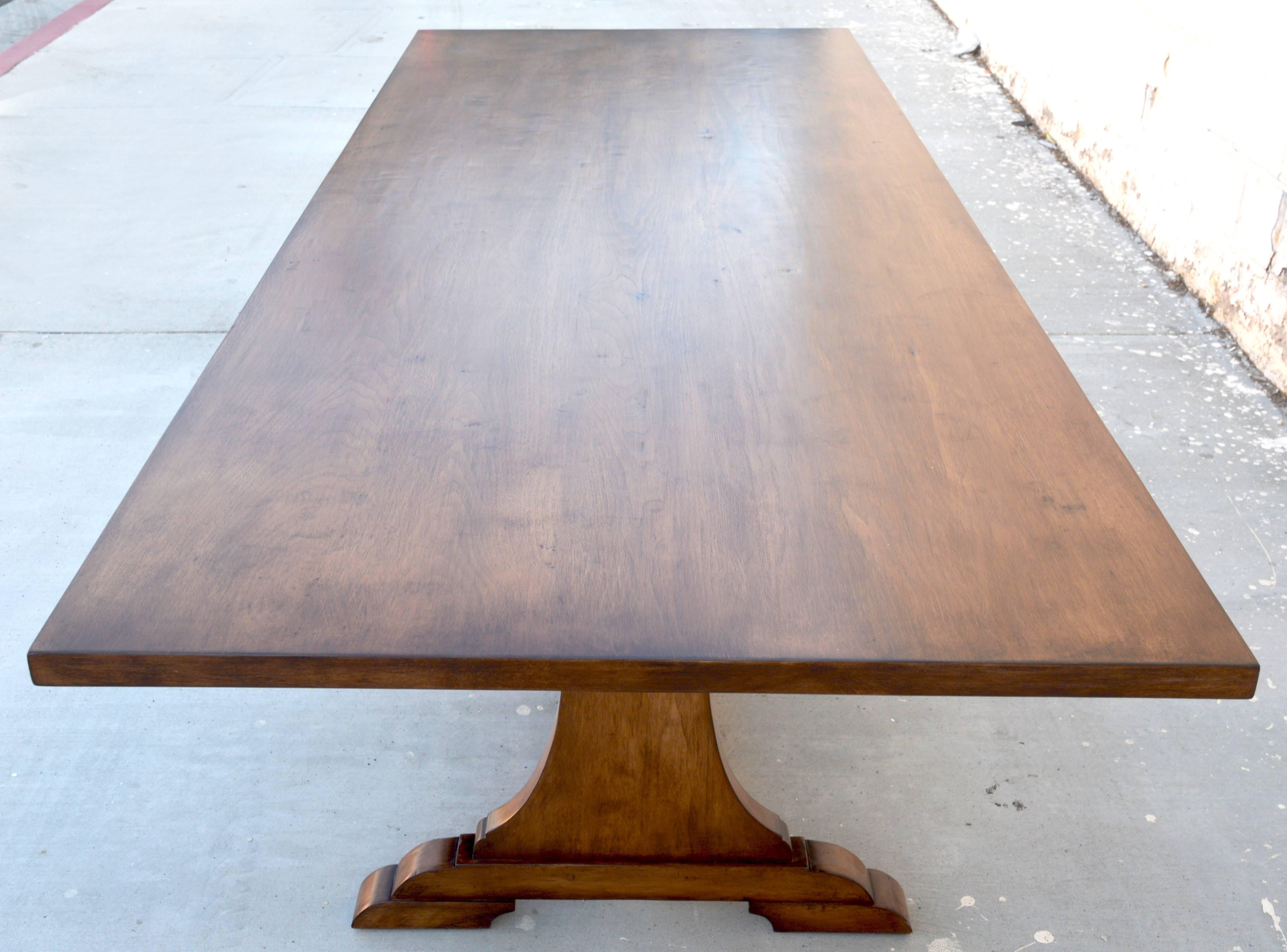 This table is built from dry-aged black walnut with the option to expand with either two or four leaves, as needed.

The sliding mechanism that locks the leaves into place is reinforced with steel bars to eliminate flexing. It stays hidden under the