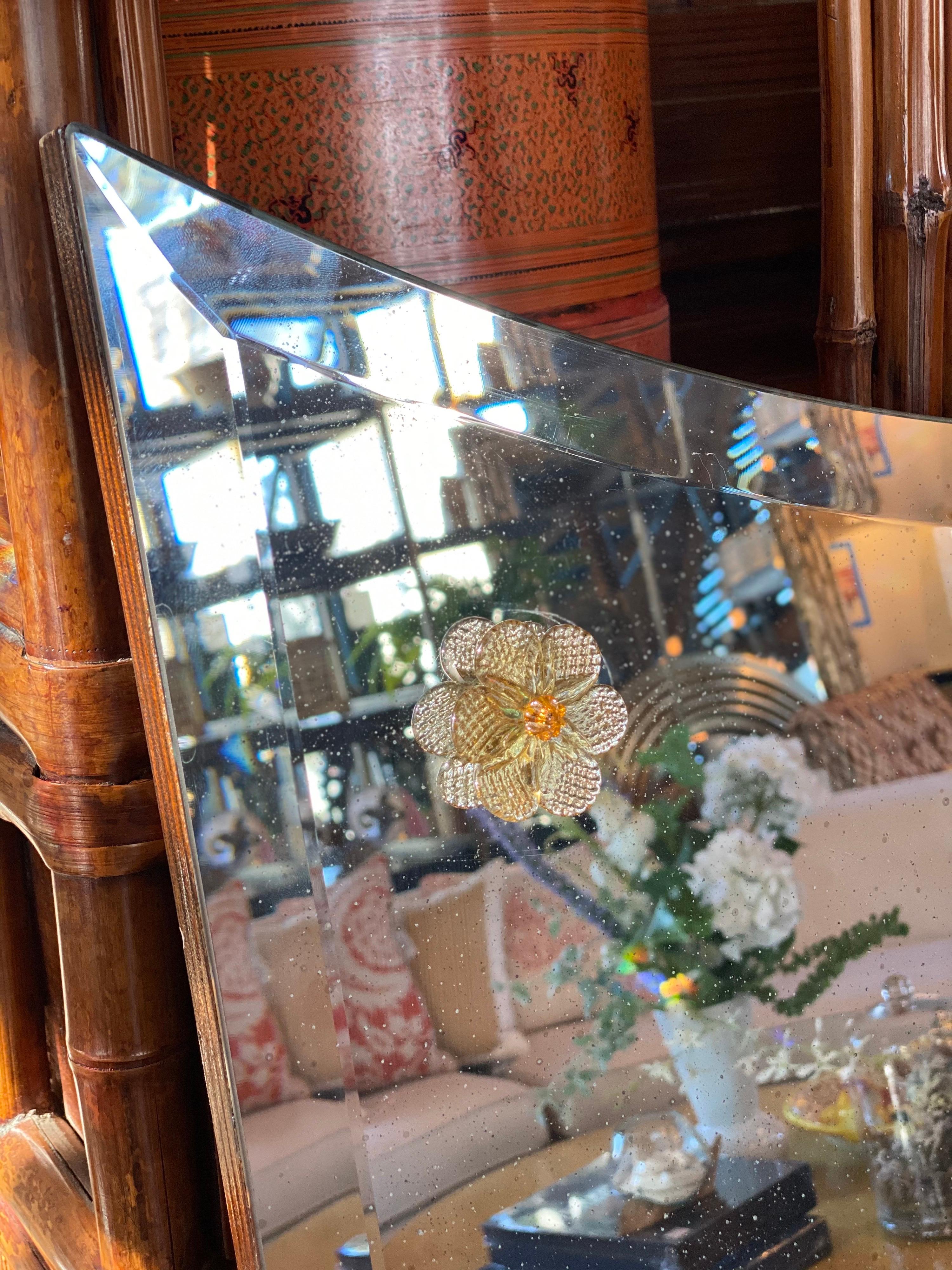 Custom Donghia mirror with Murano citrine florettes. Crescent top antiqued mirror.

Measures: 54