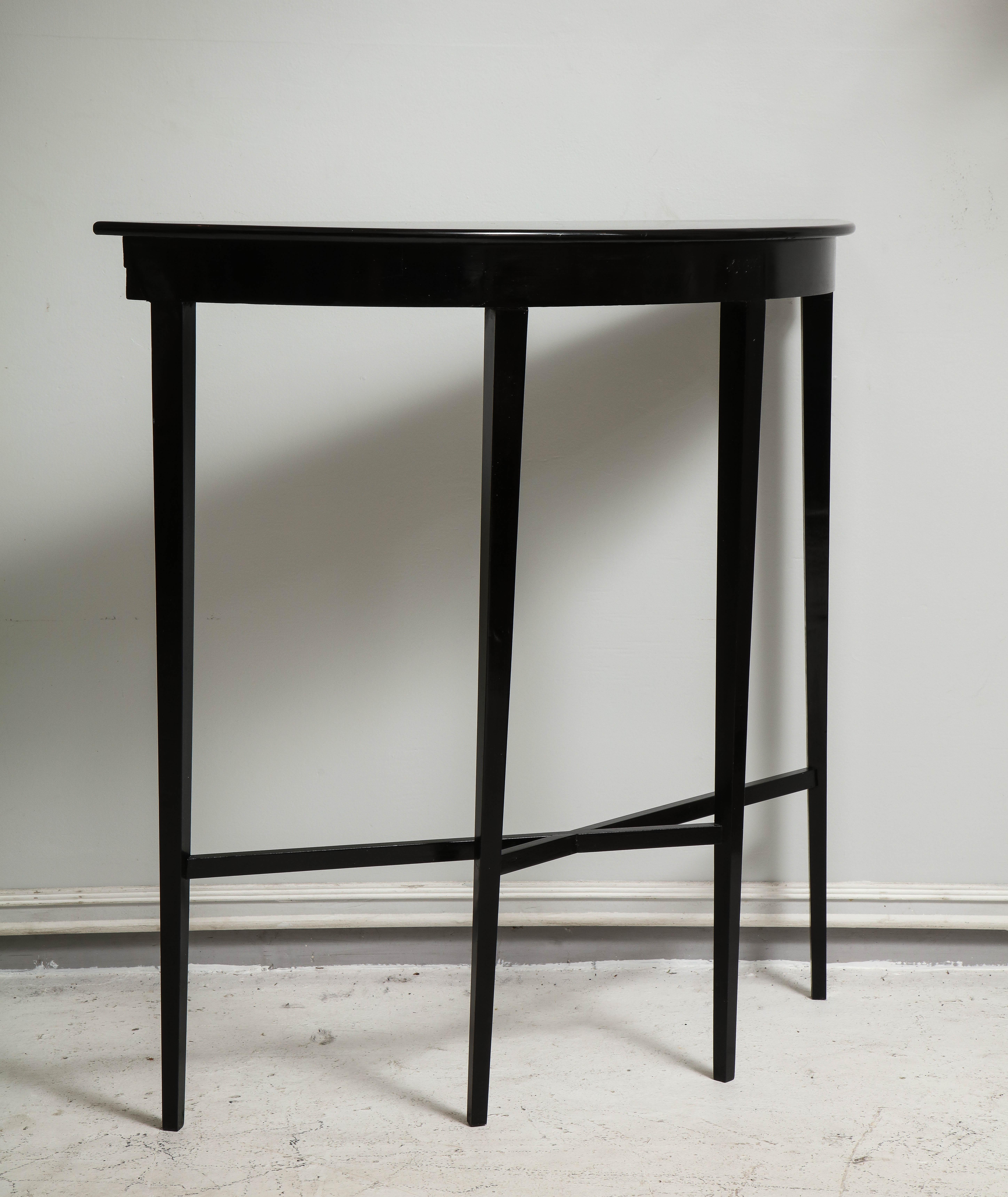 American Custom ebonized demilune console on tapered legs For Sale