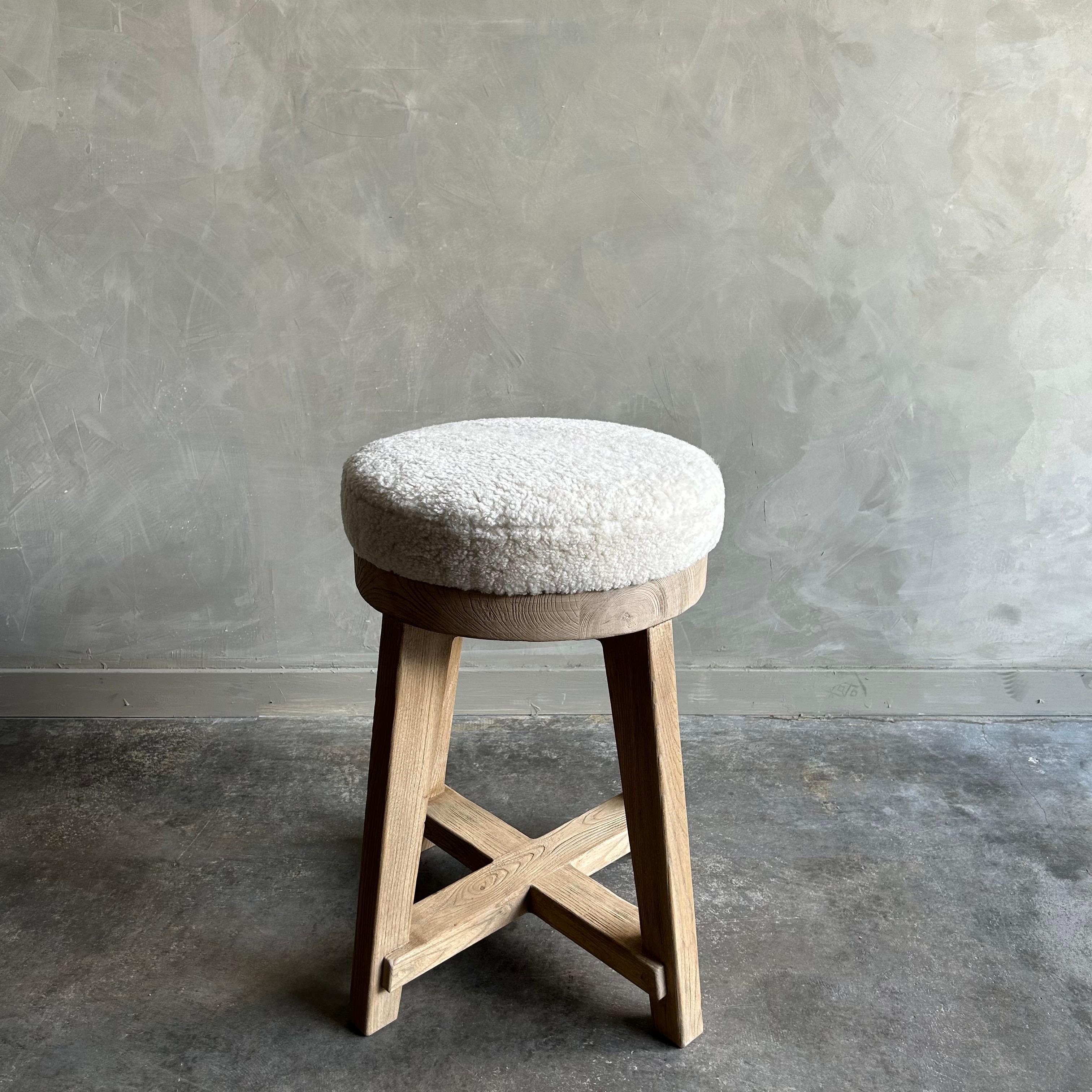 Jasper Counter Stool
Made from reclaimed elm wood timbers, this counter stool has a unique vintage feel.
Upholstered in 100% lambs sheep, we also offer C.O.M. & our Libeco Linen colors in oyster white, oatmeal and vintage flax. 
Finish: Natural
3