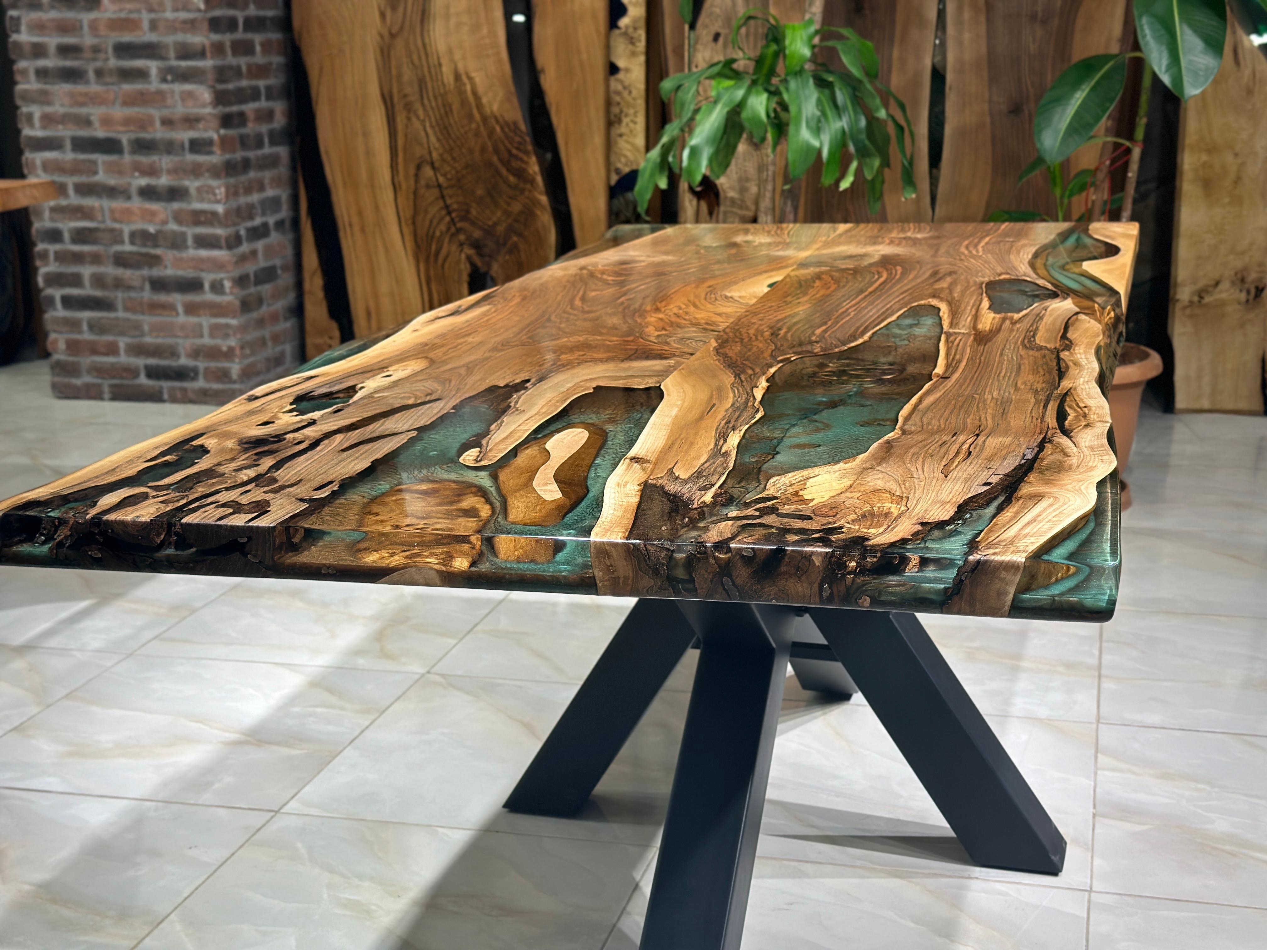 WALNUT GREEN - BROWN EPOXY RESIN DINING TABLE

This epoxy table emerges as a unique work of art, inspired by nature's beauty. 

The epoxy table stands out not only for its design but also its durability. Thanks to its epoxy coating, it is highly