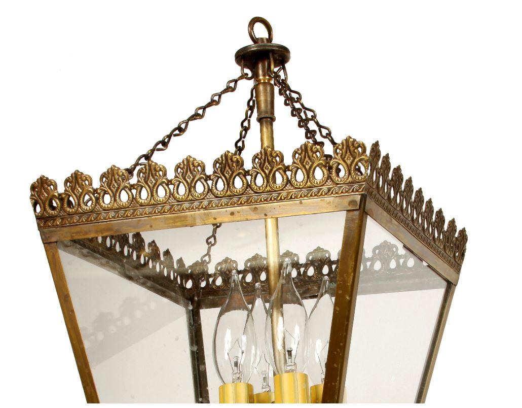 Custom European brass square lantern with intricate detail on frame, four lights.
