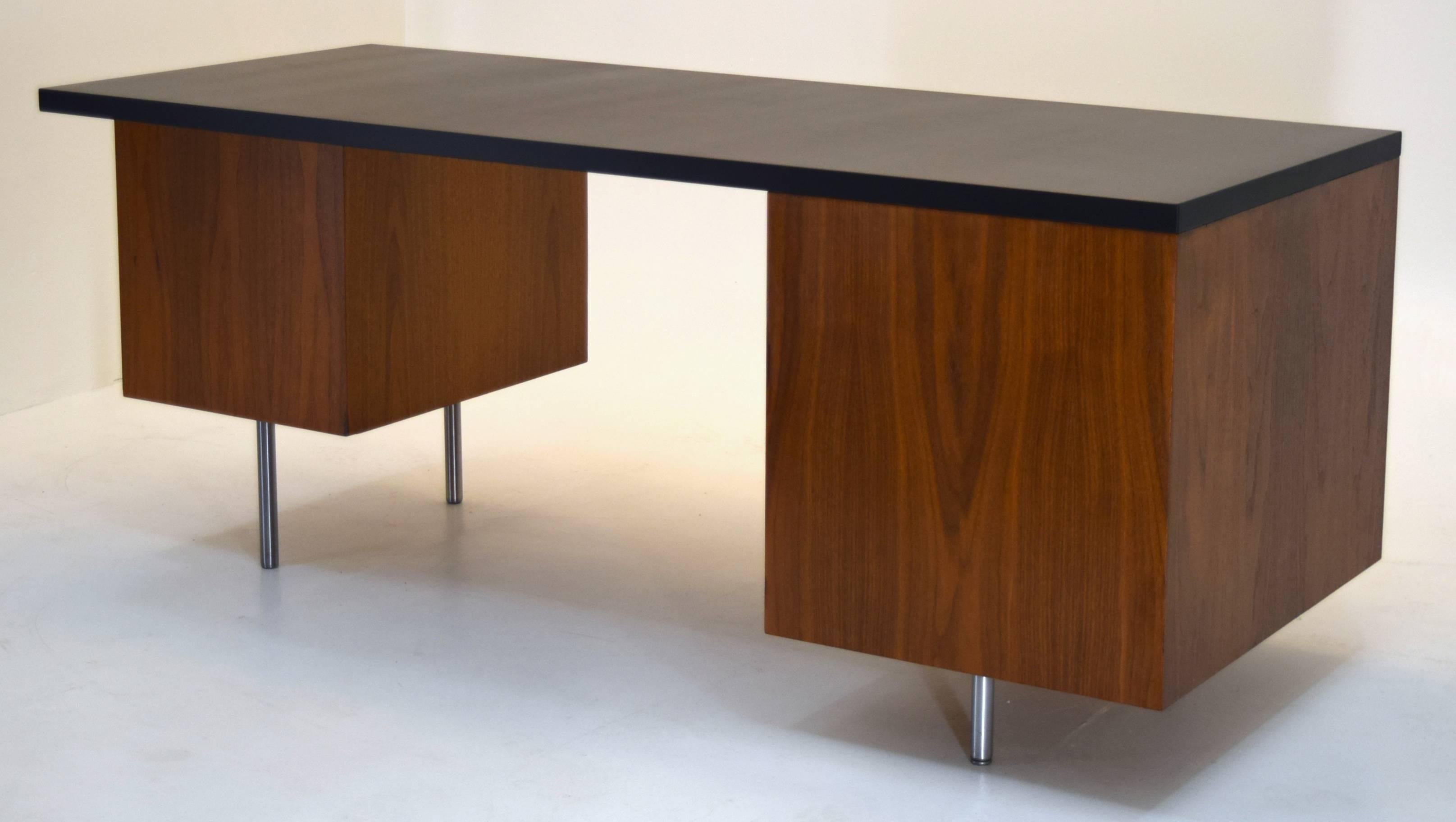 George Nelson & Associates for Herman Miller, USA
Executive Office Group Series with J-pulls, circa 1954.
Walnut, steel. Lacquer.  Measures: 72 wide x 30 deep and 29.75 inches tall. Knee area is 32.5