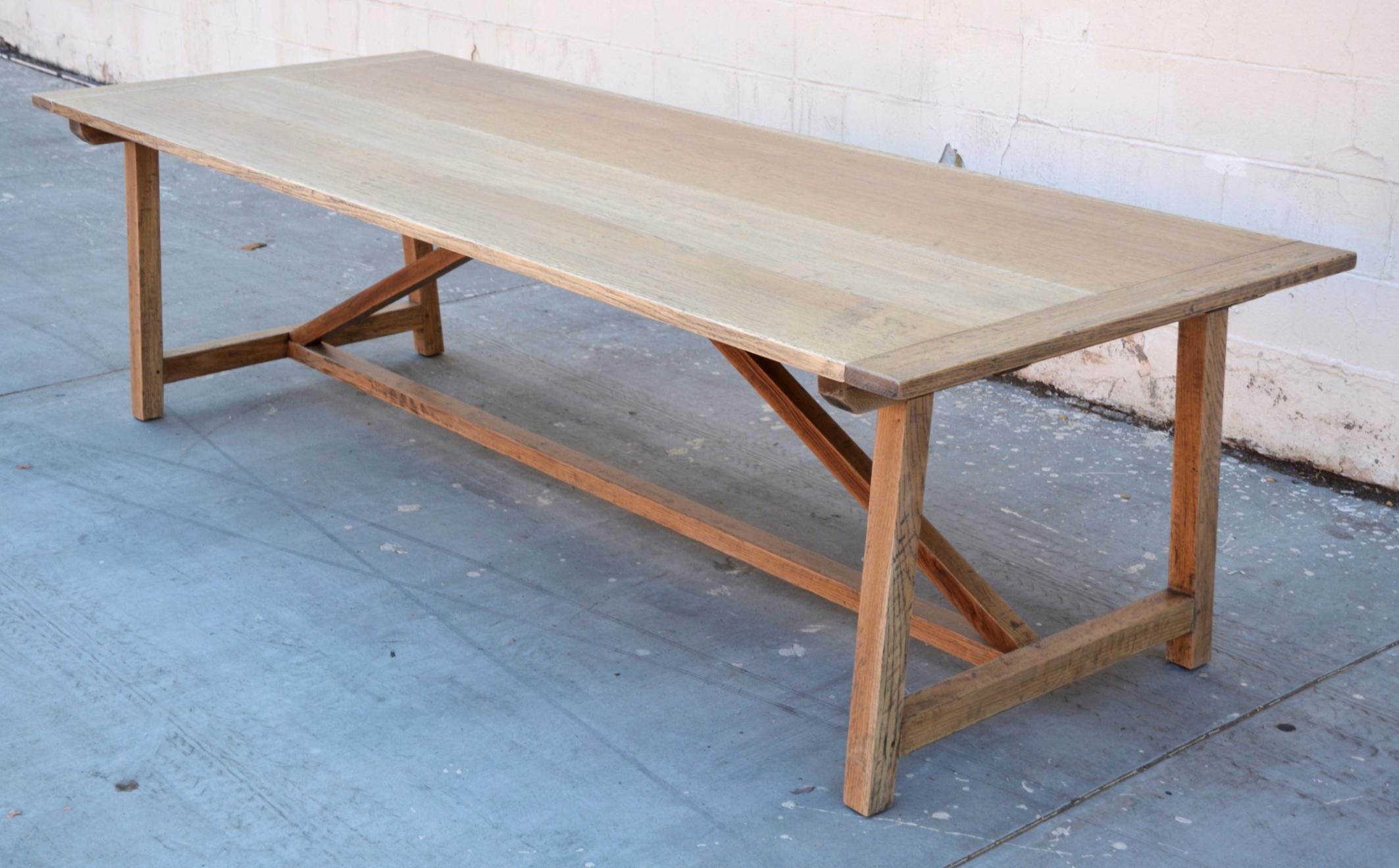 This custom built farm table is made from distressed, rift sawn oak and can be made with or without extension leaves. The table shown here is 112