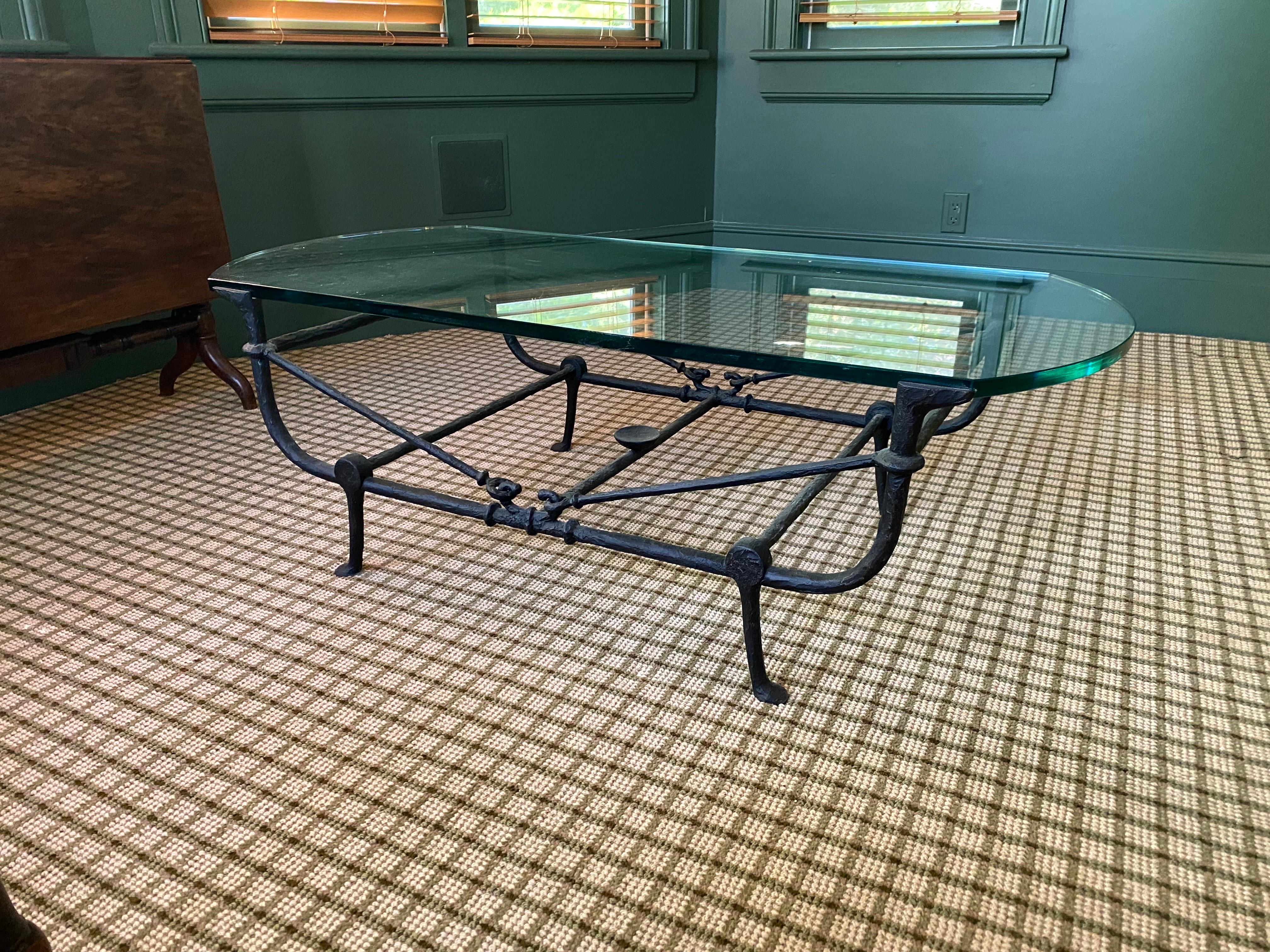 Custom Fabricated Iron & Glass Coffee Table
A handsome black iron custom made coffee table frame in a thicker Giocometti-esque style with a thick glass top. Glass top straight on long sides and rounded on either end. Light wear to the top, light