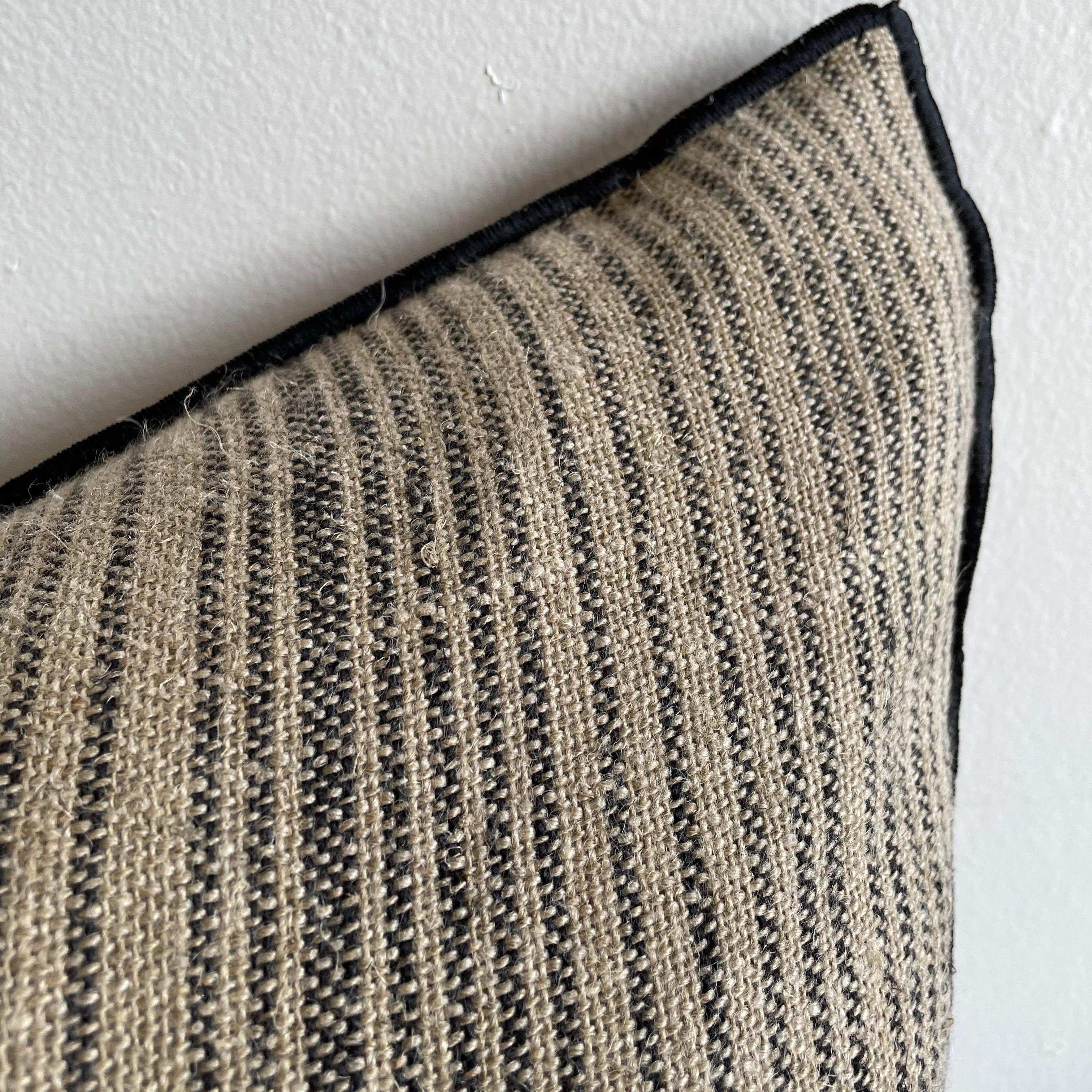 Custom flax linen with black ticking stripe lumbar pillow
Size: 15 x 23
 Thick soft, nubby textured style pillow with a stitched edge, metal zipper closure. Our pillows are constructed with vintage one of a kind textiles from around the globe.
