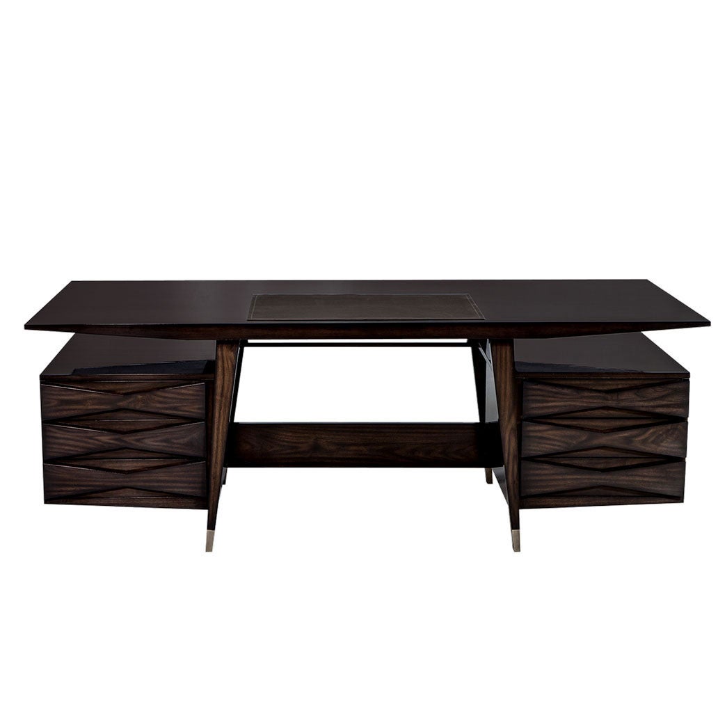 Coupling both classic and modern elements into one stylish design, this writing desk from the Carrocel Custom collection presents a picture of flat cut walnut elegance. A rectangular floating top with inset leather and tapered sides rests on splayed