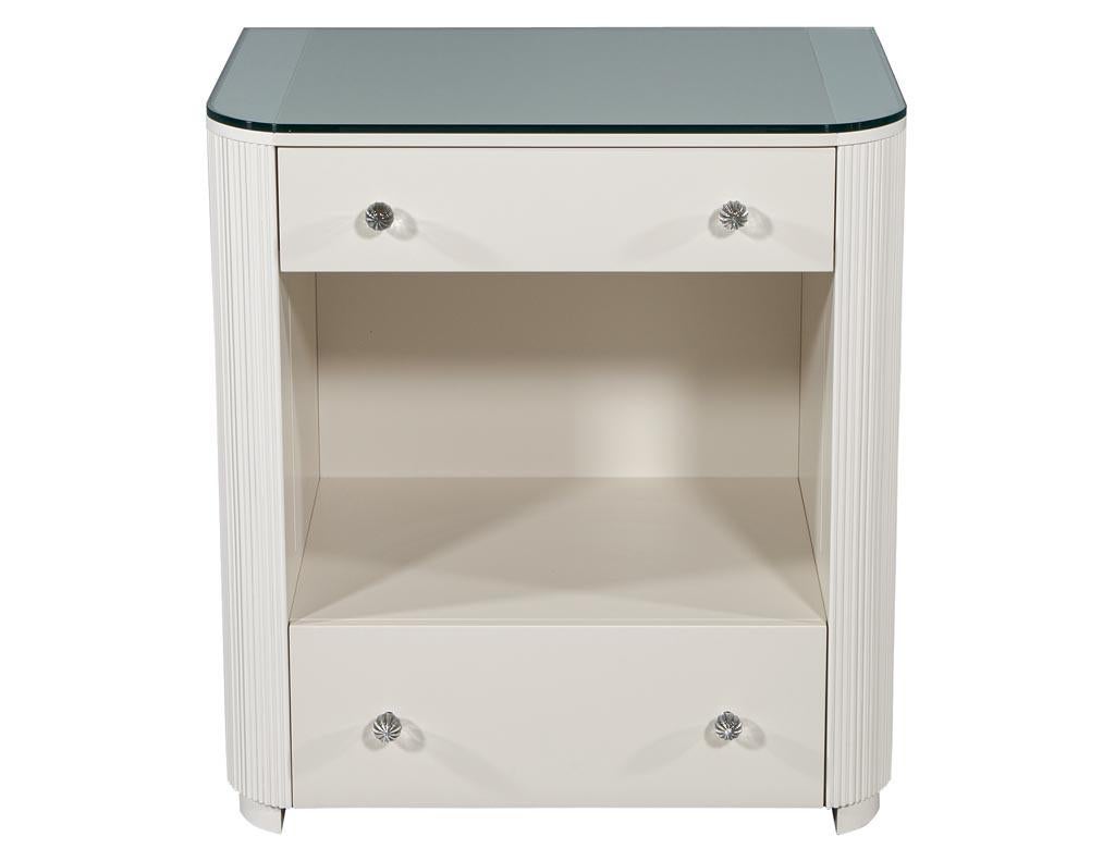 Custom fluted cream bedside nightstand table. Handcrafted and custom made to order here at Carrocel in Toronto, Canada. Featuring 2 drawers, hidden side compartments and back painted glass top. Priced individually but available in any quantity. Lead