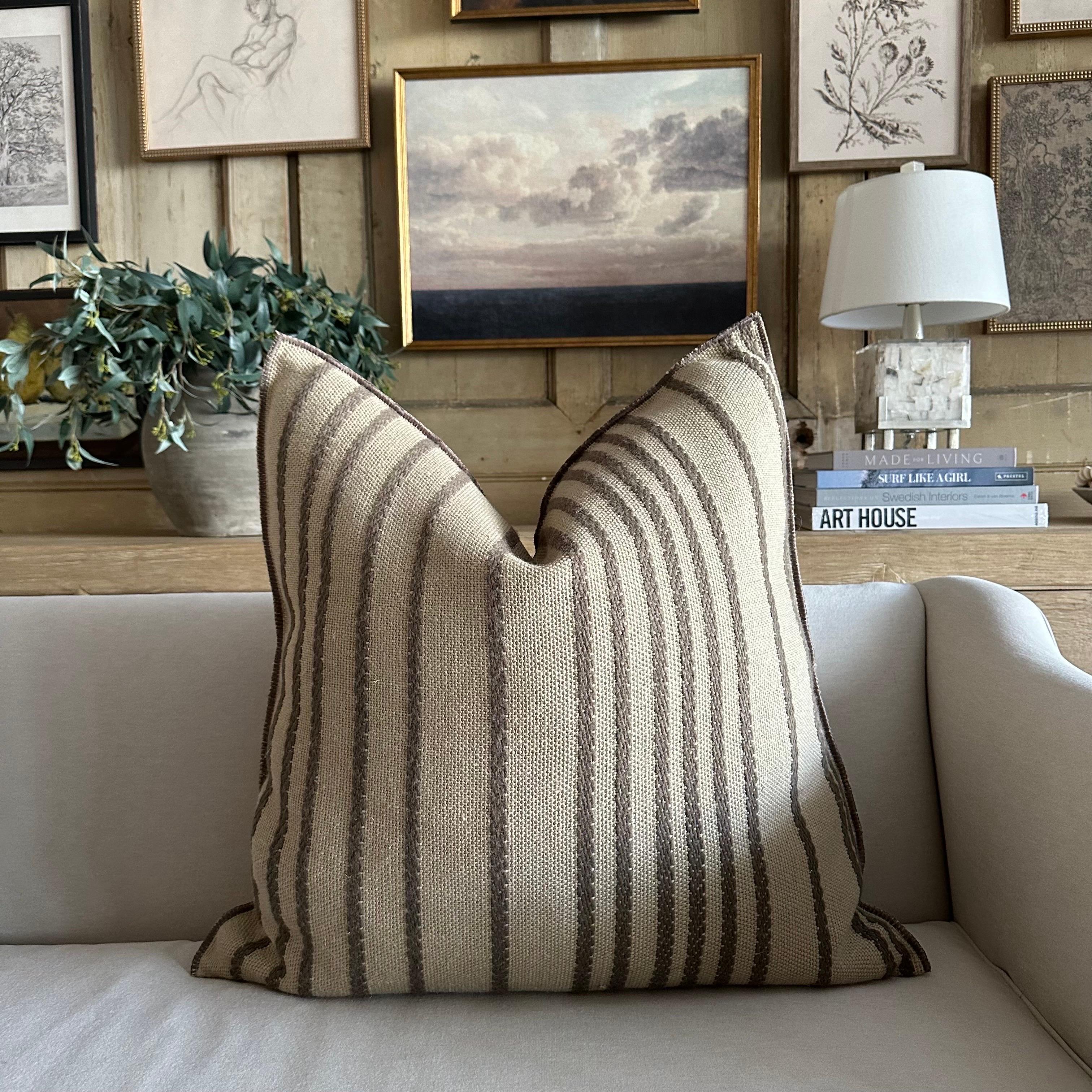 MDV Embroidered Myre Rayure 
Color: Ecorce (a bronze with gray hues)
Size 26x26
A beautiful natural flax, heavy weight linen, with a deep dark gray bronze embroidered stripe pattern. 
These pillows are crafted from a luxurious wool, and linen blend,