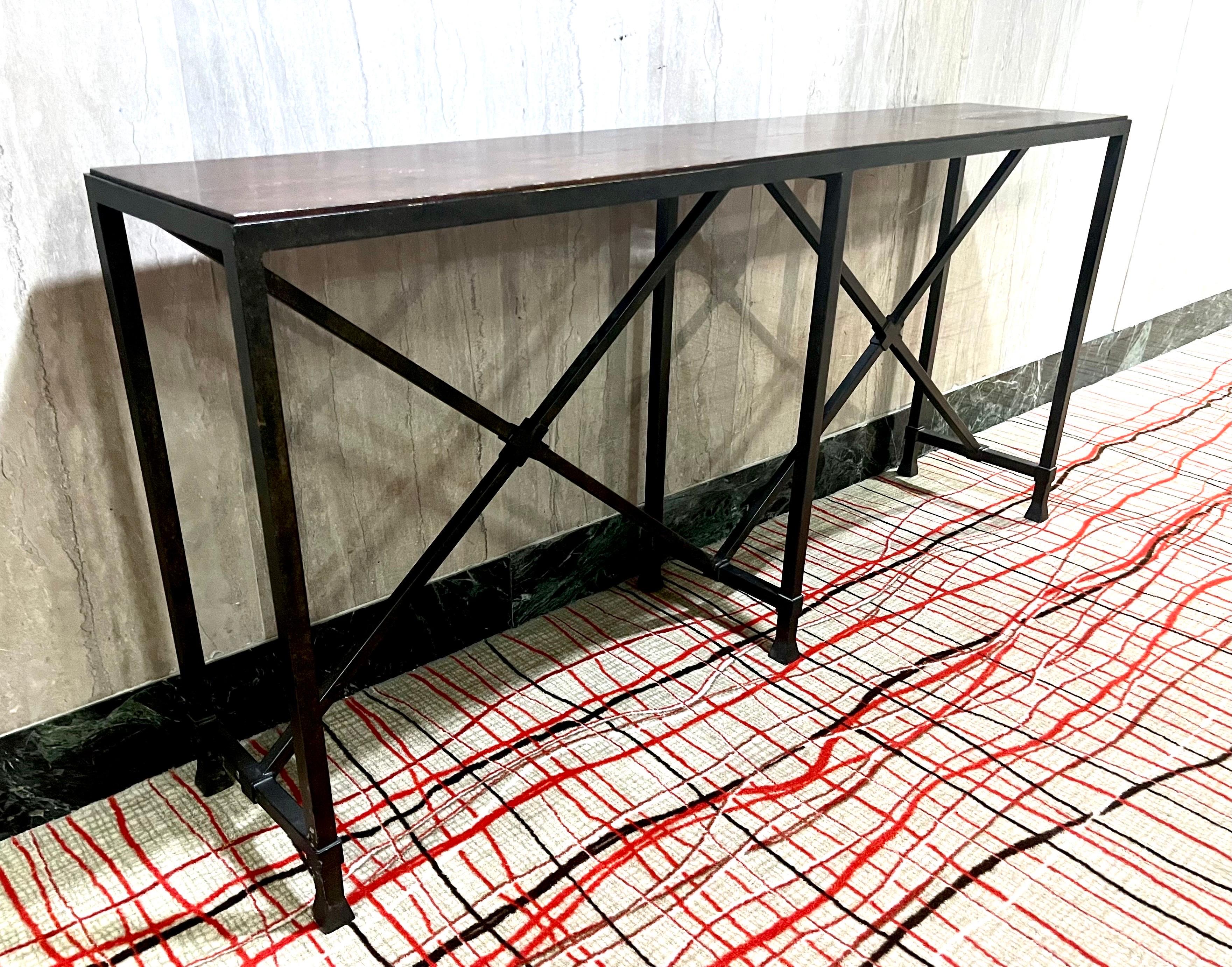 An Elegant, Large, Custom French Modern Neoclassical Console in Hand Hammered Wrought Iron with an Inlaid Stone Top, in the style of French Master Ironworker and Designer, Raymond Subes. The console table embraces dramatic, classic French styling