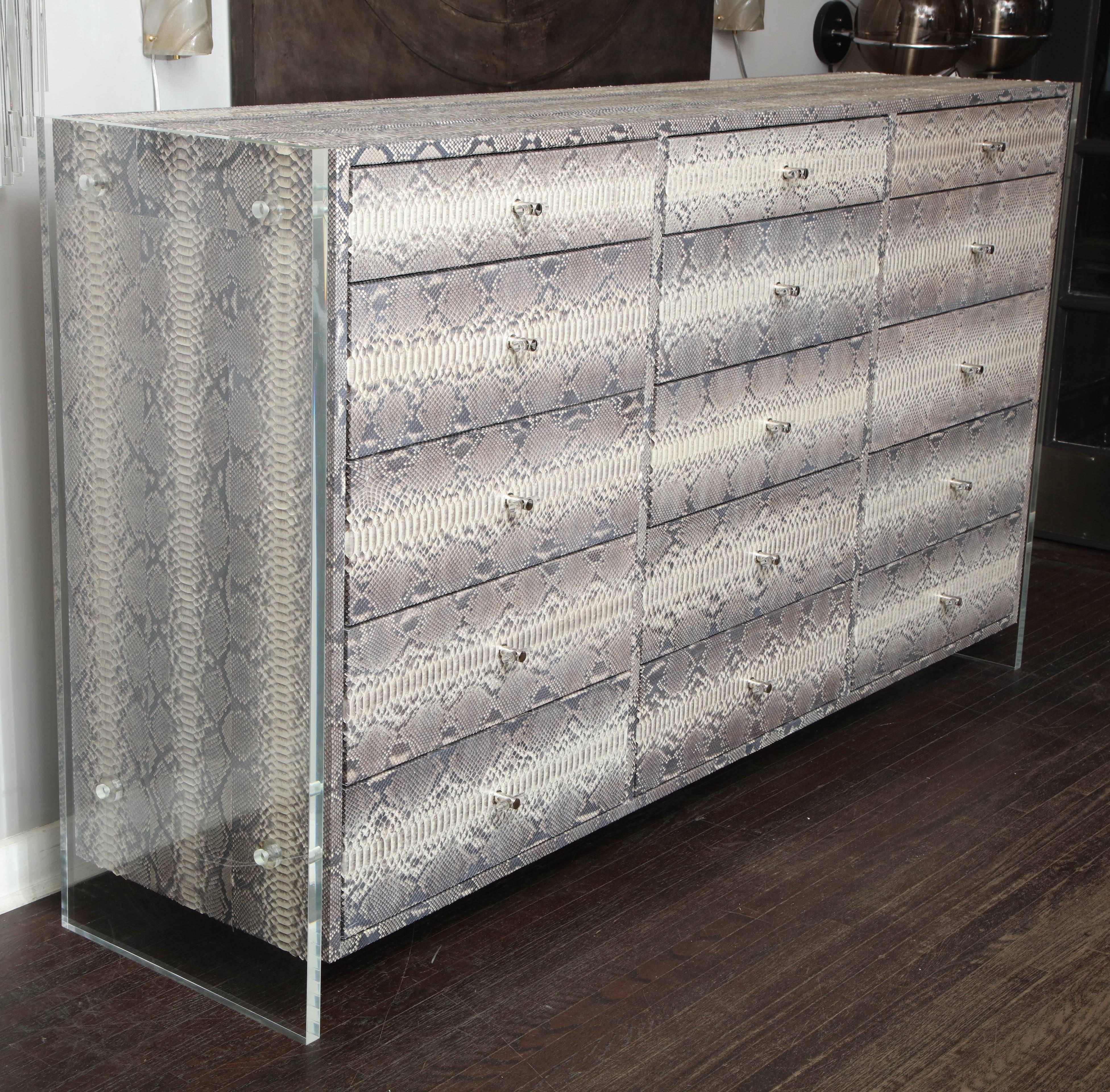 Custom 15-drawer python dresser with Lucite side panels. Customization available in different sizes, hardware and colors.