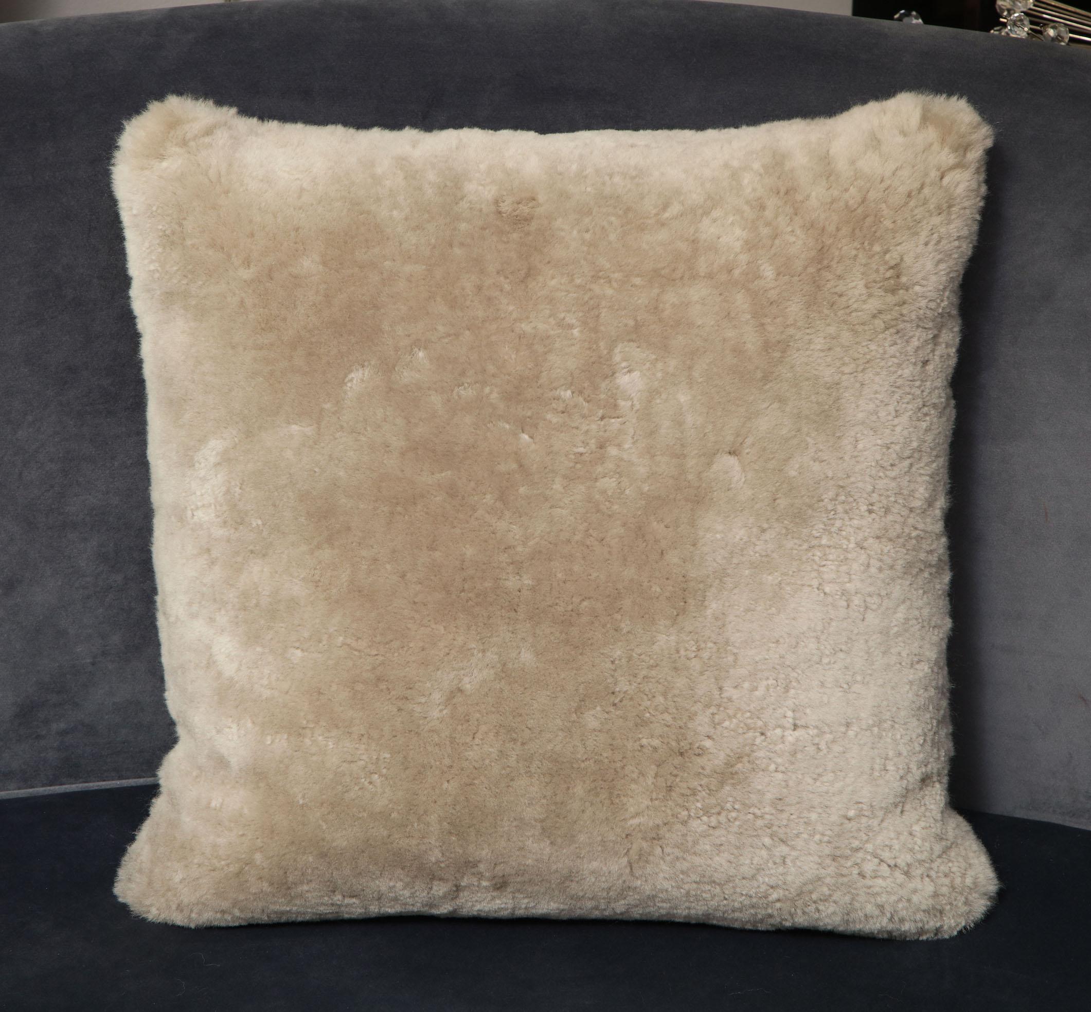 Genuine shearling pillow in taupe color. 2 available for immediate purchase. Also, custom sizing is available.


