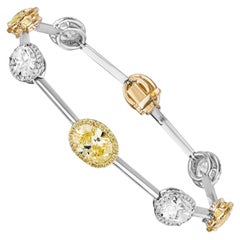 Custom GIA Certified 7.61 Carat Fancy Yellow and White Oval Diamond Bracelet