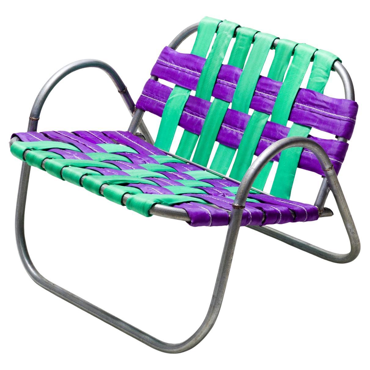 "RAIR Chair", chaise verte et violette tissée, matériaux de construction réutilisés.