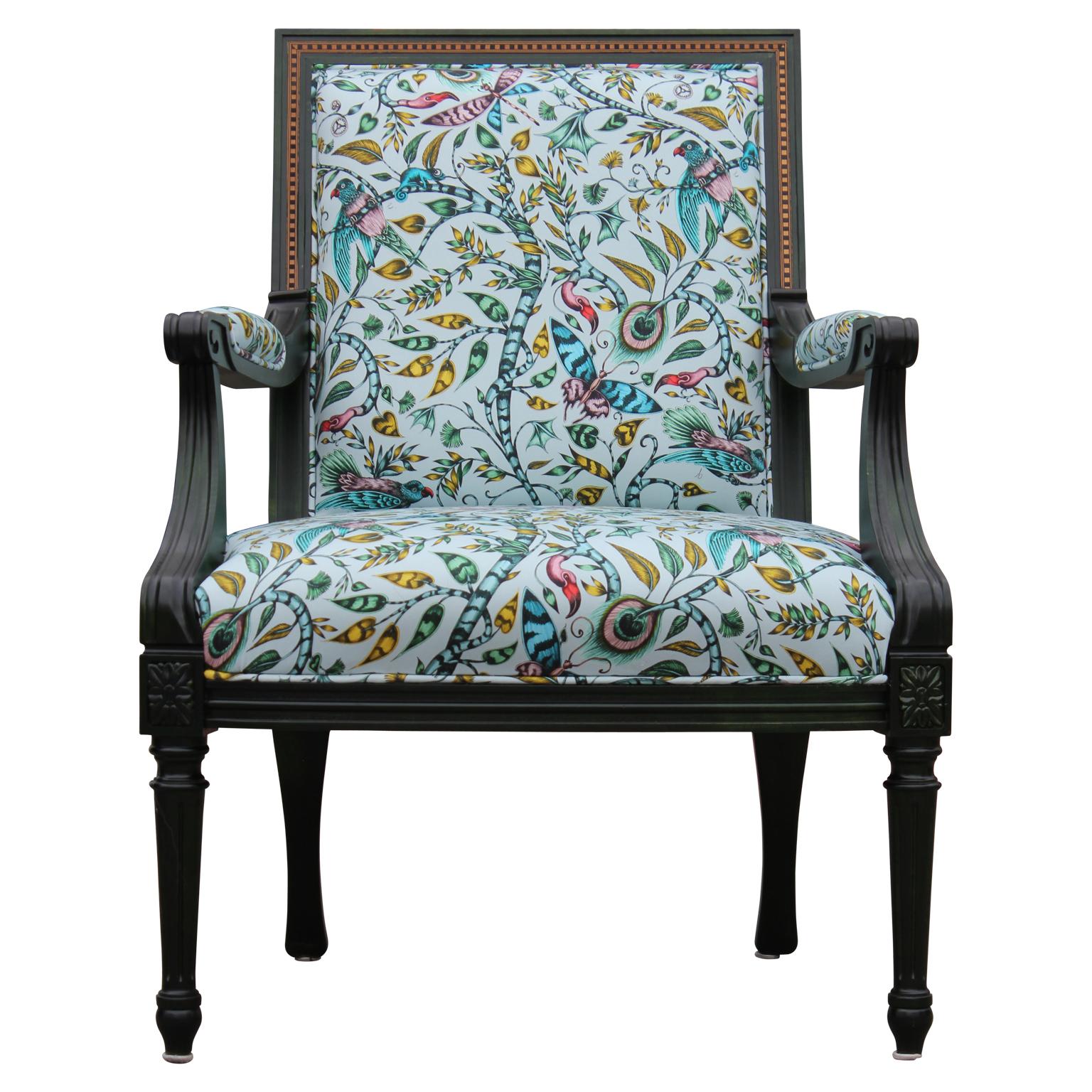 Beautiful Louis the XV style green dyed French armchair with custom tropical upholstery featuring a tropical animalia pattern.