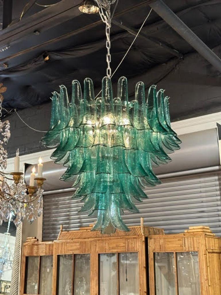 Stunning saddle shaped green Murano glass waterfall chandelier. Makes a beautiful statement. So pretty!!