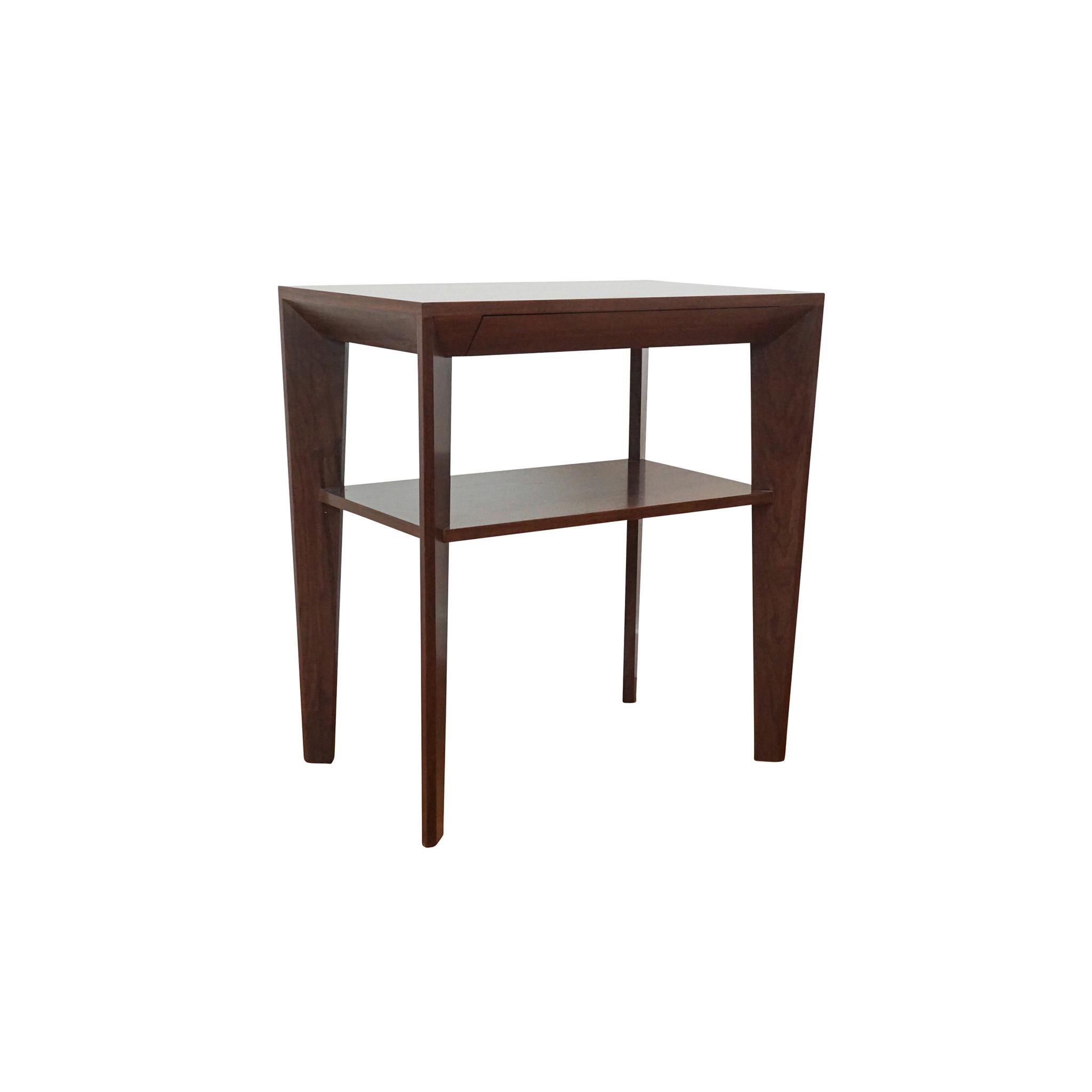Lovely petite beside table with multi-sided diagonal base. Equipped with discreet mitered pencil drawer with soft-close hardware. Shown in medium walnut.

Lead time: 6-8 weeks

width: 28