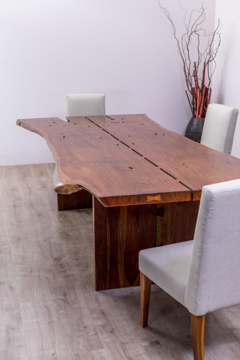 A true one-of-a-kind piece, these hard-to-find Rosewood live edge slabs are mirrored and joined with butterflies. Any table will be custom built to size and availability and will need to be individually quoted. This table measures approximately