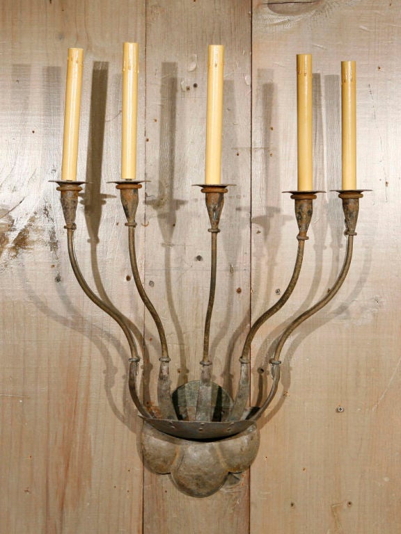 Our Exclusive Design, the Fisher sconce is custom blacksmith-made in the USA. Looks great in a stairwell or flanking a fireplace. Newly wired with all UL listed parts and five arms. Can be finished with candelabra or Edison sockets. Price is for one