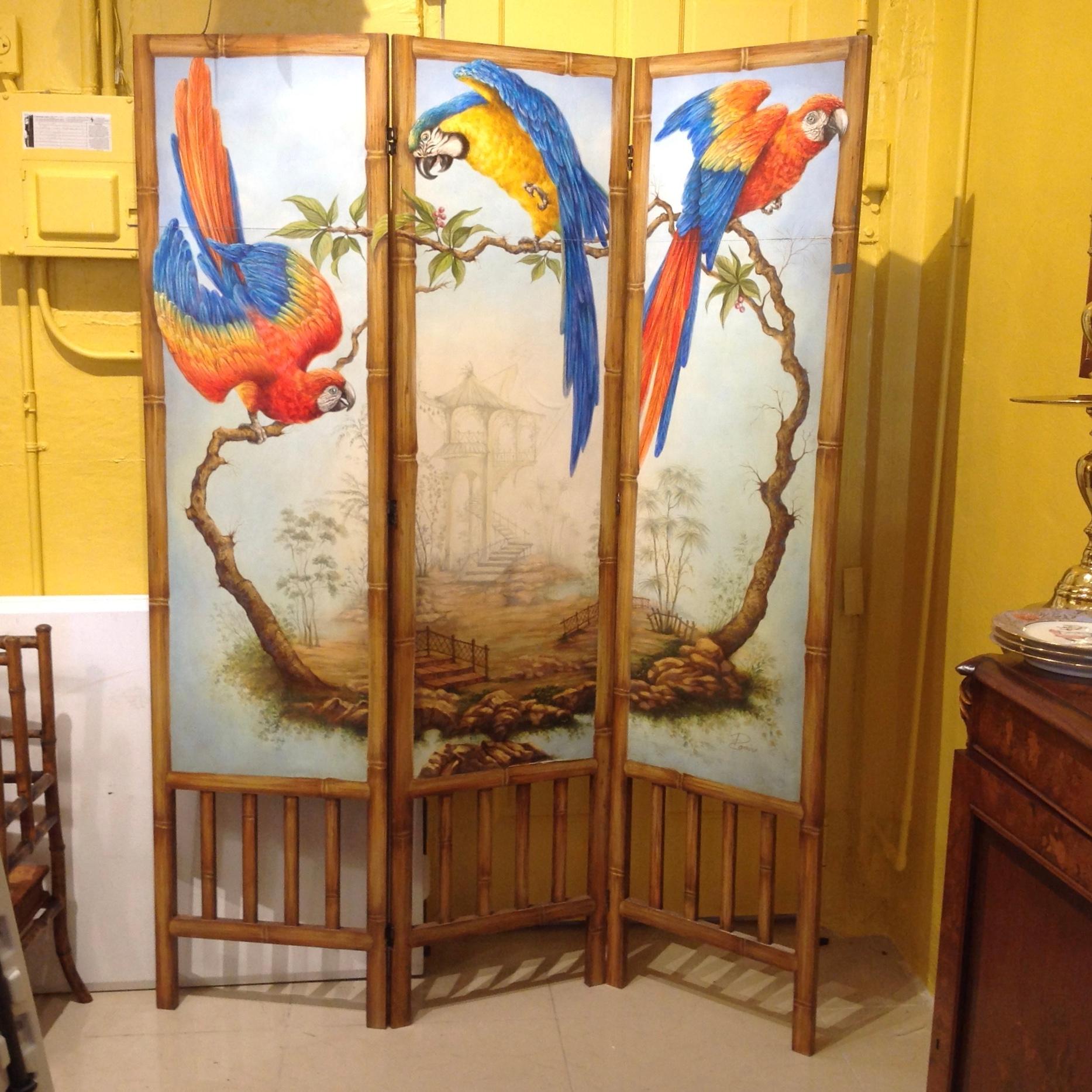 One of a kind - hand fashioned and original painted screen by acclaimed Cuban American muralist Ramiro Ramirez. The beautifully detailed pagodas are accented by life-size parrots creating a tropical flavor. The screen is bolstered by a 