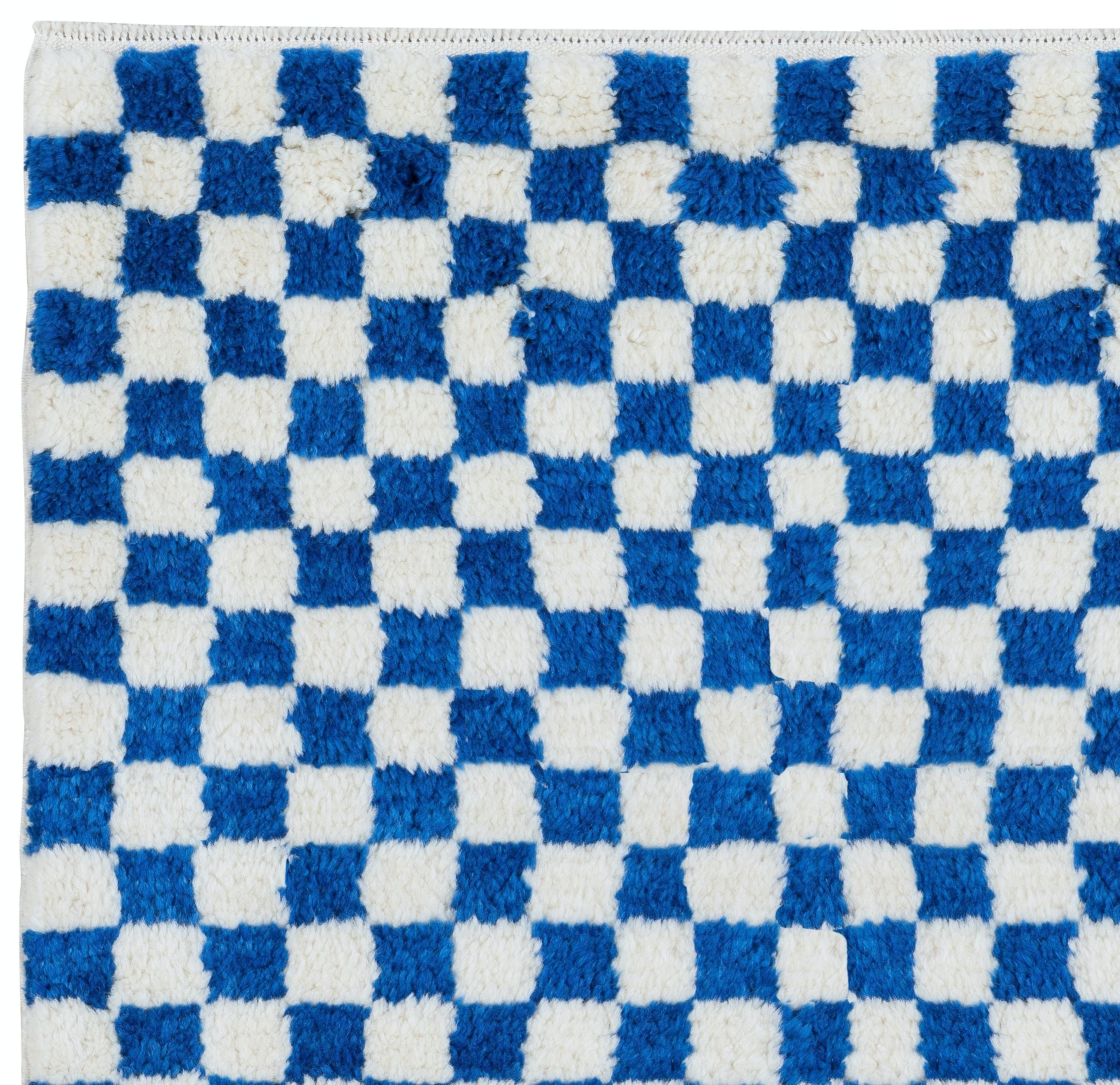 A custom, handmade Tulu rug made from 100% Hand-Spun Wool of finest quality. It features a simple checkered design in cream and blue. 

It can be CUSTOM-PRODUCED in any Design, Size, Color Combination and Pile Thickness requested. 

These