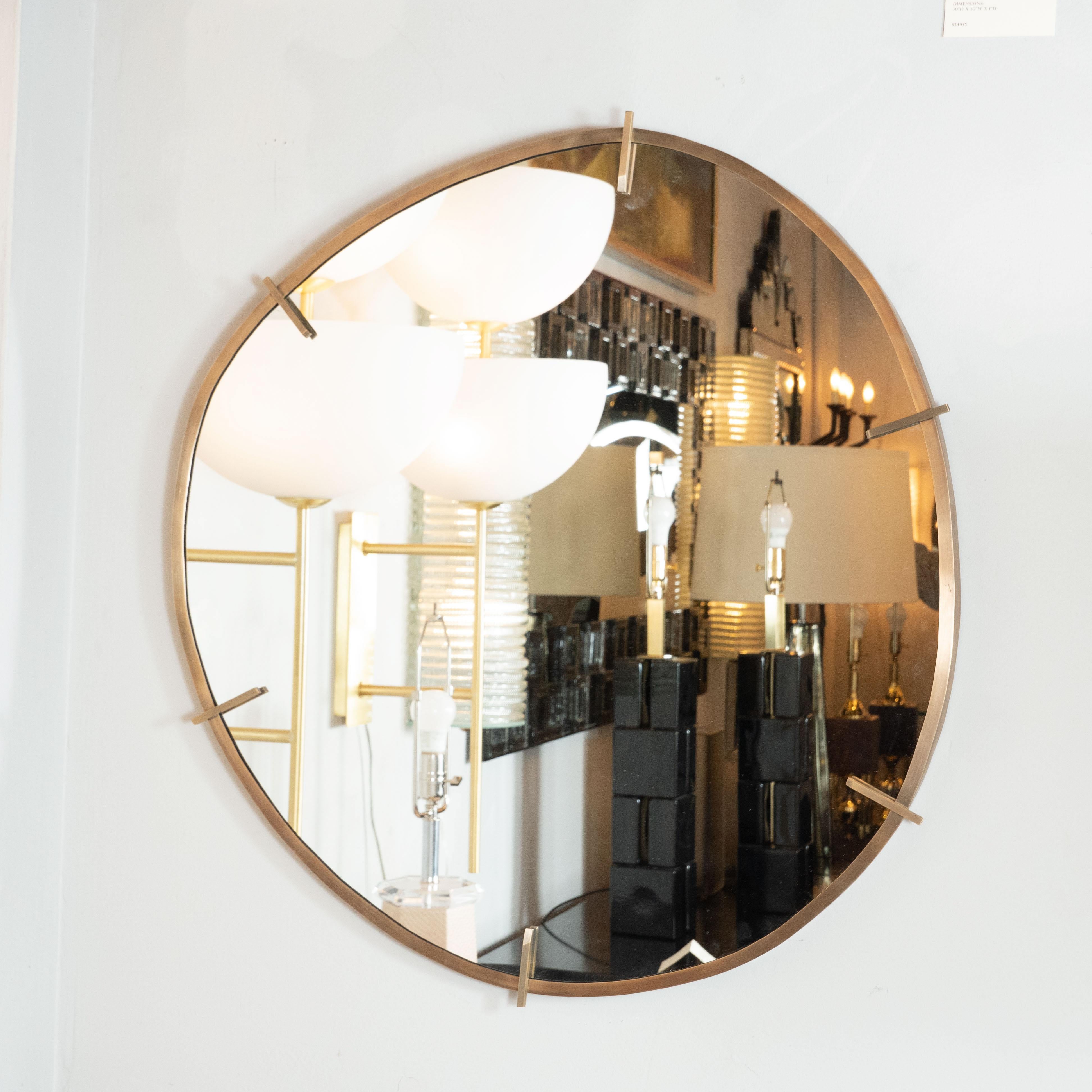 Handmade by our exclusive atelier, this refined mirror represents one of the few contemporary pieces that we carry, and for good reason. It embodies the old-world craftsmanship and lines of Mid-Century Modernist design that we treasure. It is an