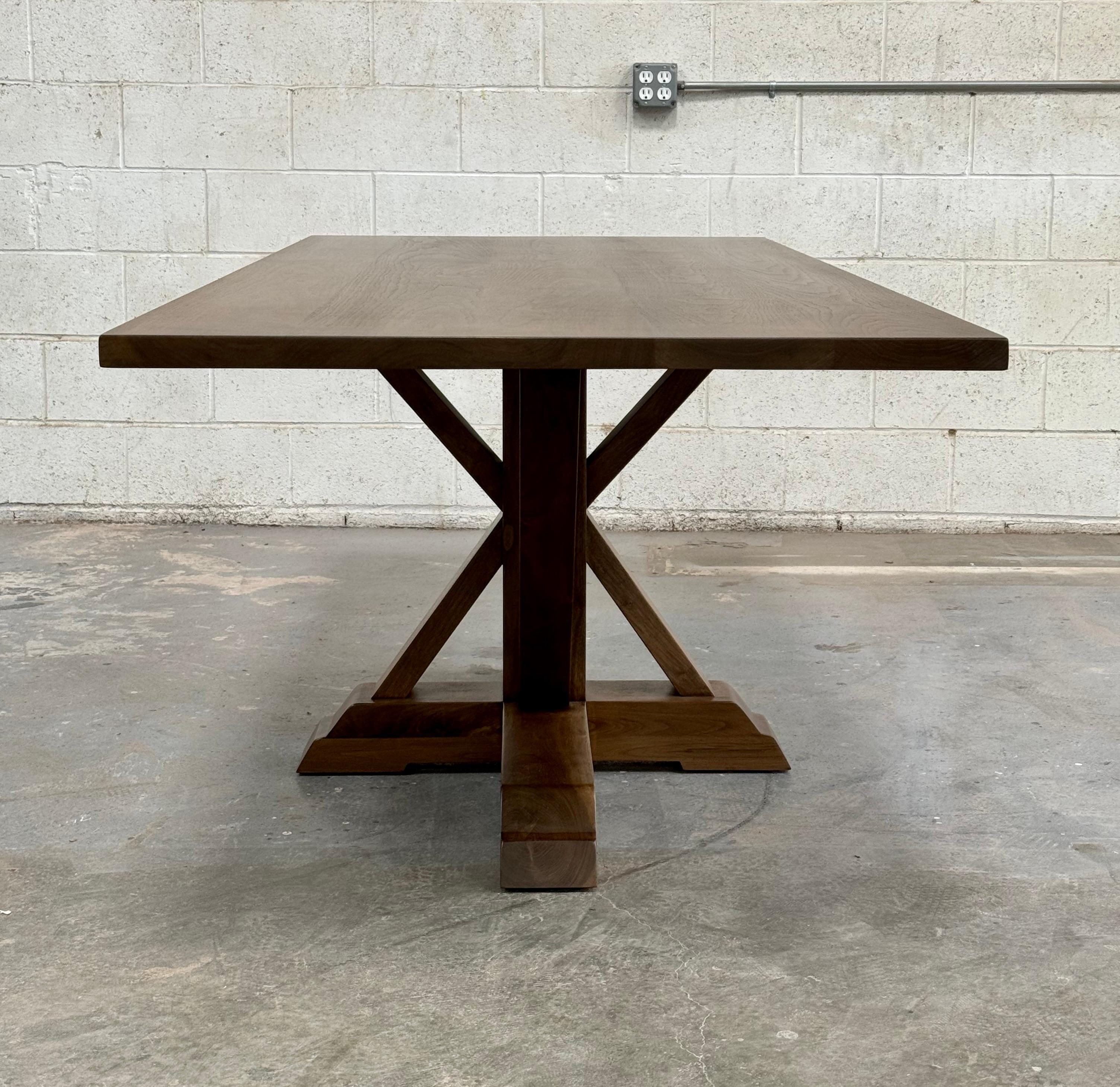 This custom rectangular dining table made from walnut is seen here in 84