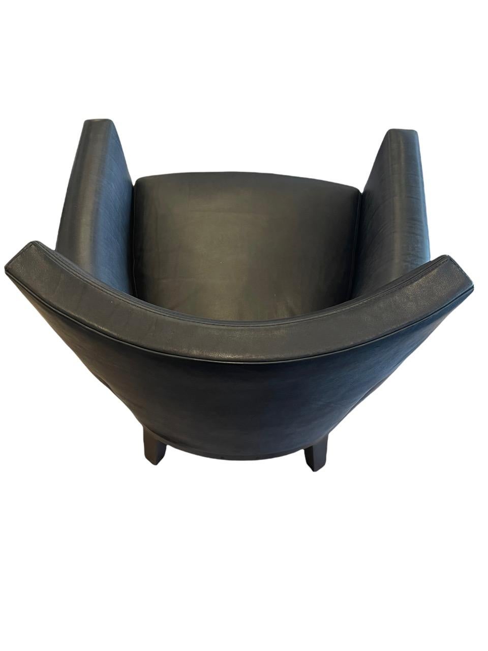 Custom Holly Hunt Jockey Club chair in Black Lucca Onyx leather. The brand is very unique and offers a curated experience featuring their designs as well as represented collections from designers, artists and artisans. They are known for their