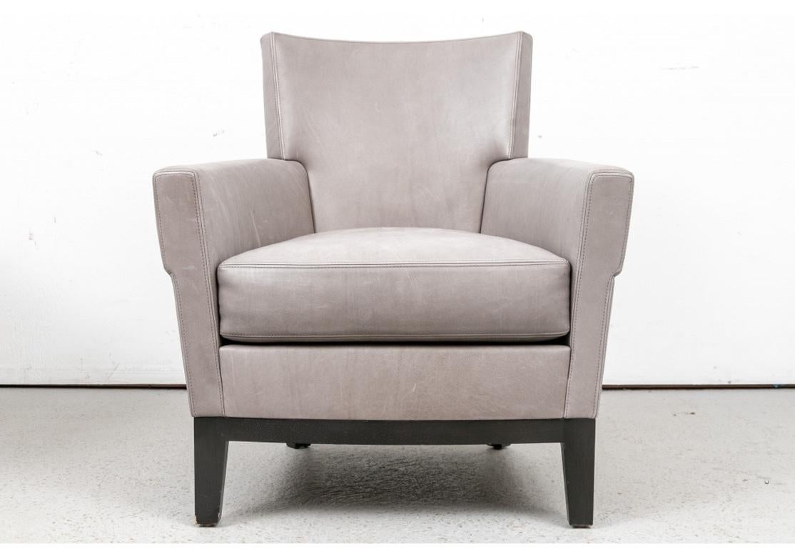 Fine construction with ebonized tub form frame in one piece with the square tapering legs, slightly splayed. With a square back and shaped arms. 
H. 31