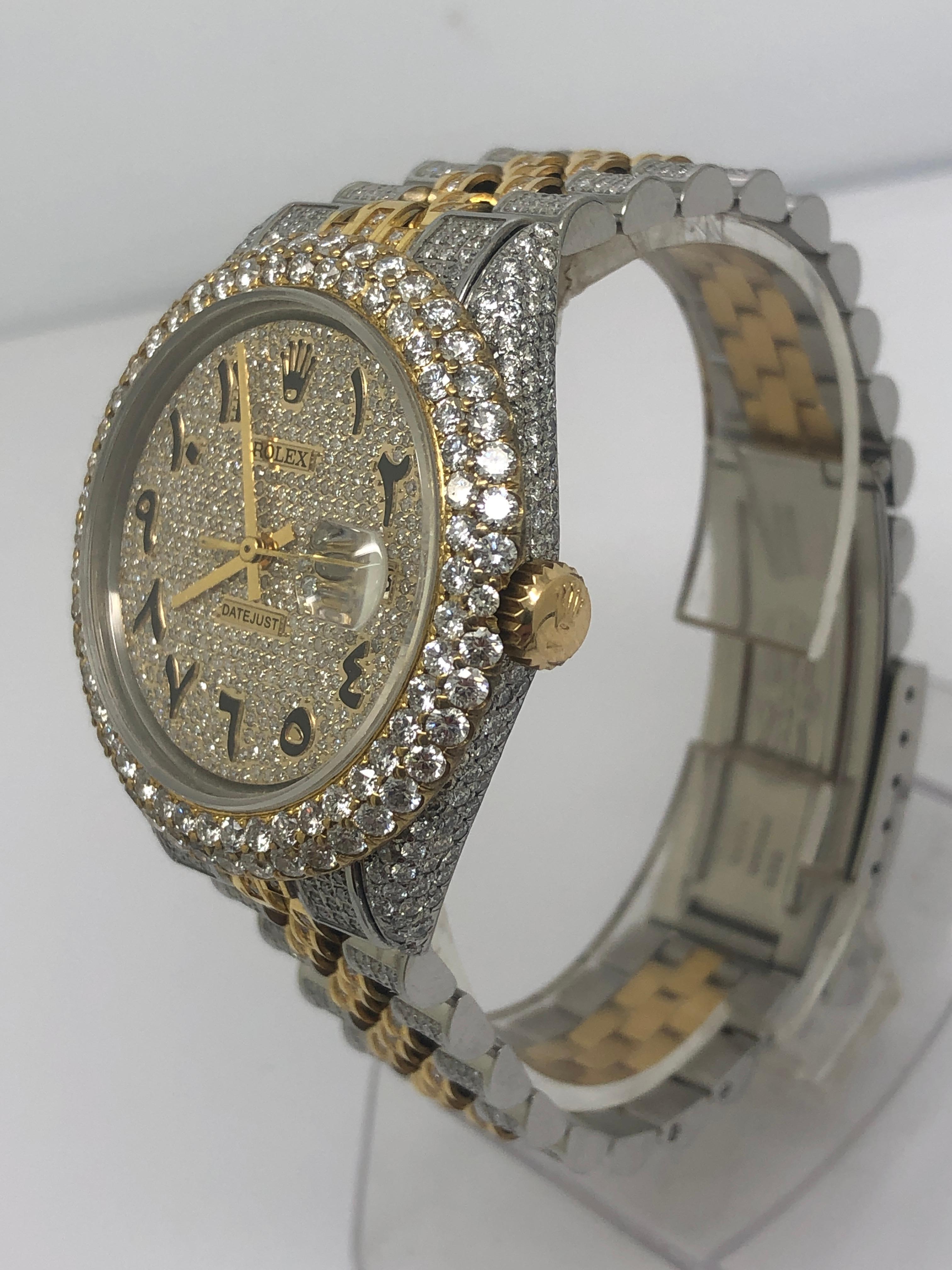 100% Authentic Rolex Datejust Iced out completely with collection quality vs white natural diamonds

20 carats in collection quality diamonds

yellow gold and stainless steel bracelet fully linked size 9 inches links can be removed

fully iced out