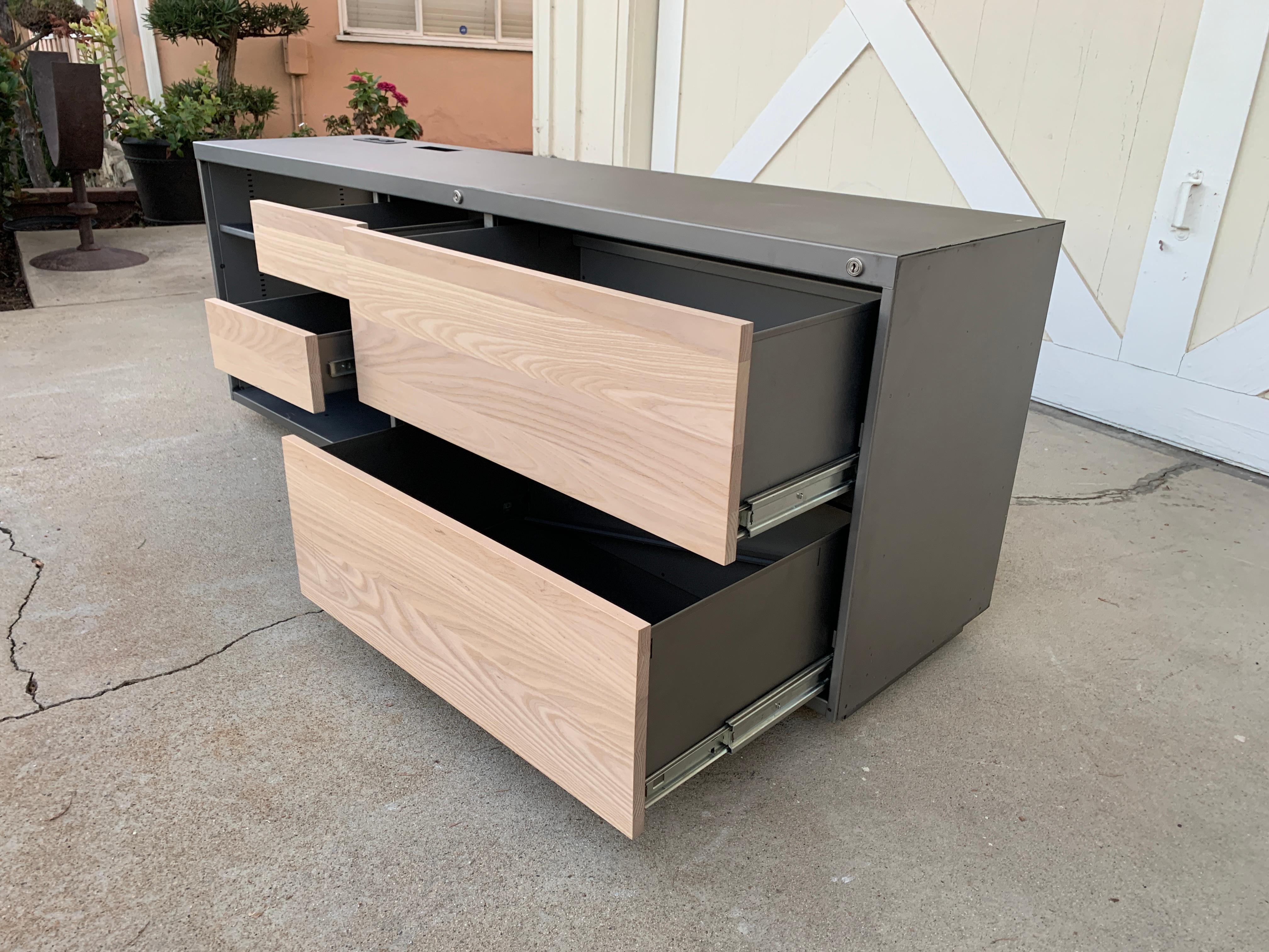 Custom Industrial credenza handmade in Los Angeles California.The piece is made of solid steel, the drawers have maple wood fronts, they also have an outlet to power appliances like computer or other electronics.

The drawers have a locking