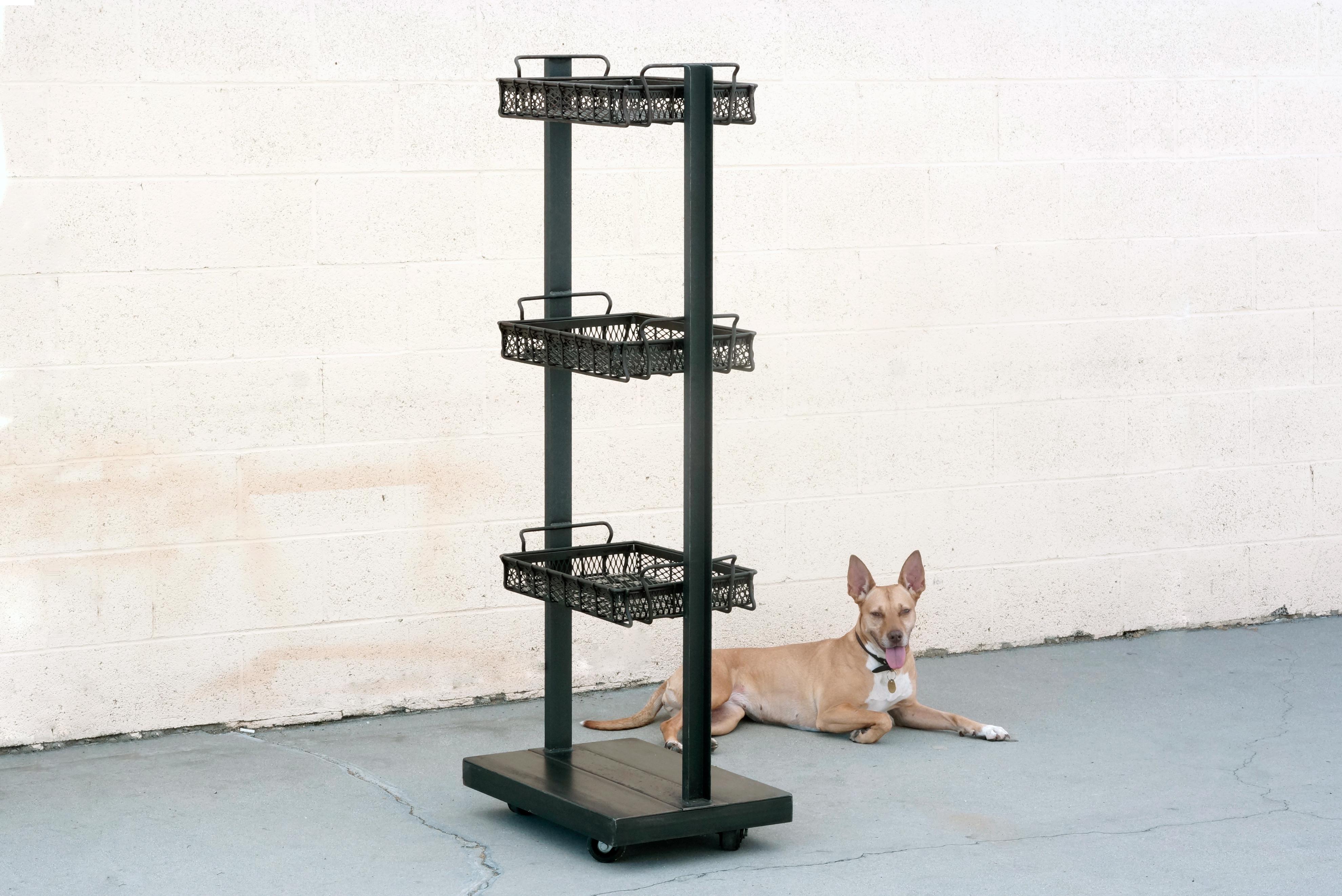 Thoughtfully conceived industrial display rack, originally made my Environment Furniture of Los Angeles. This unique 3-tier unit combines 1920s industrial steel baskets in a sleek custom-made steel frame. Rolls on casters. Ideal as a retail display