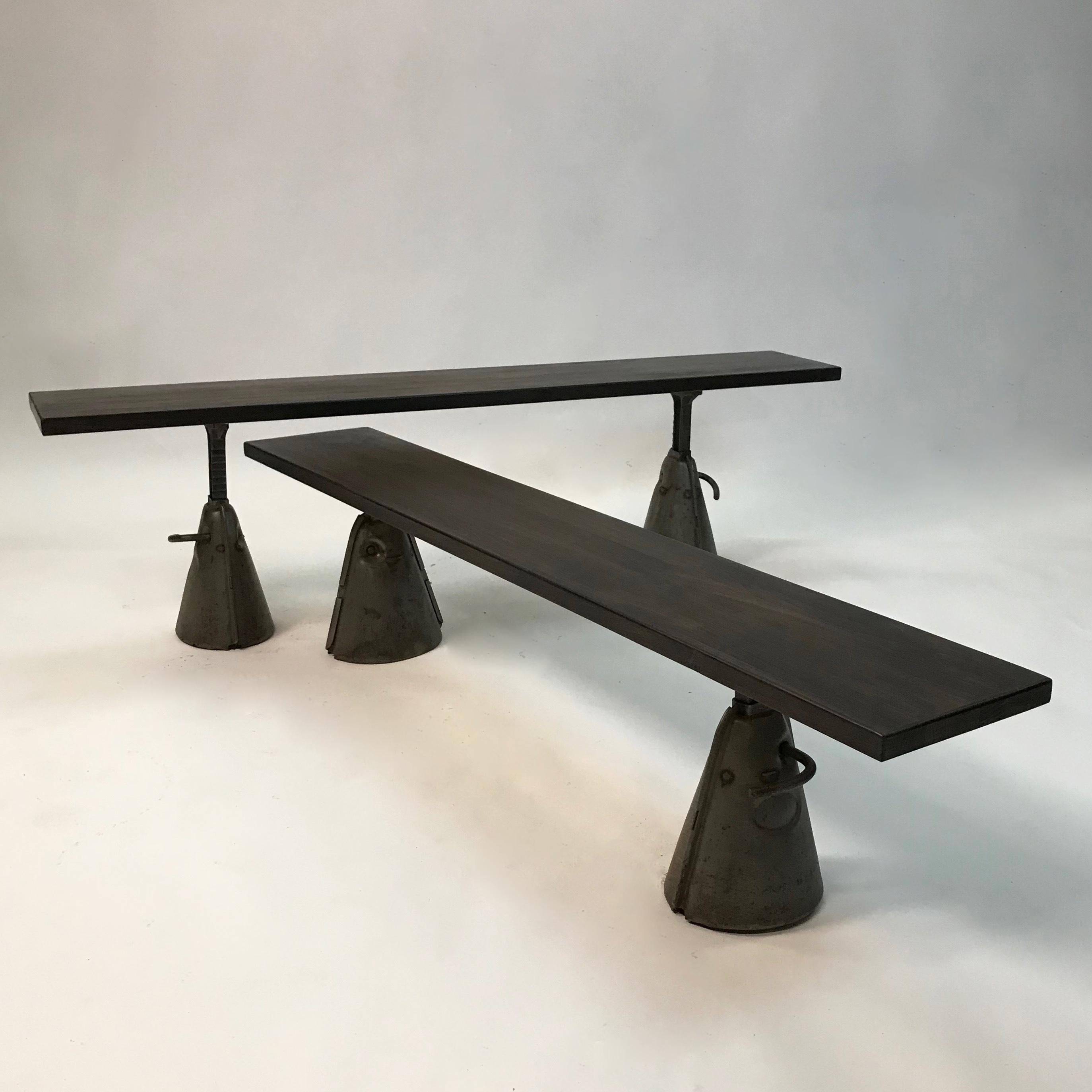 Custom, Industrial bench features an ebonized, reclaimed maple top with cast iron legs that are height adjustable from 12 - 20 inches with brushed steel feet. One bench is now available.