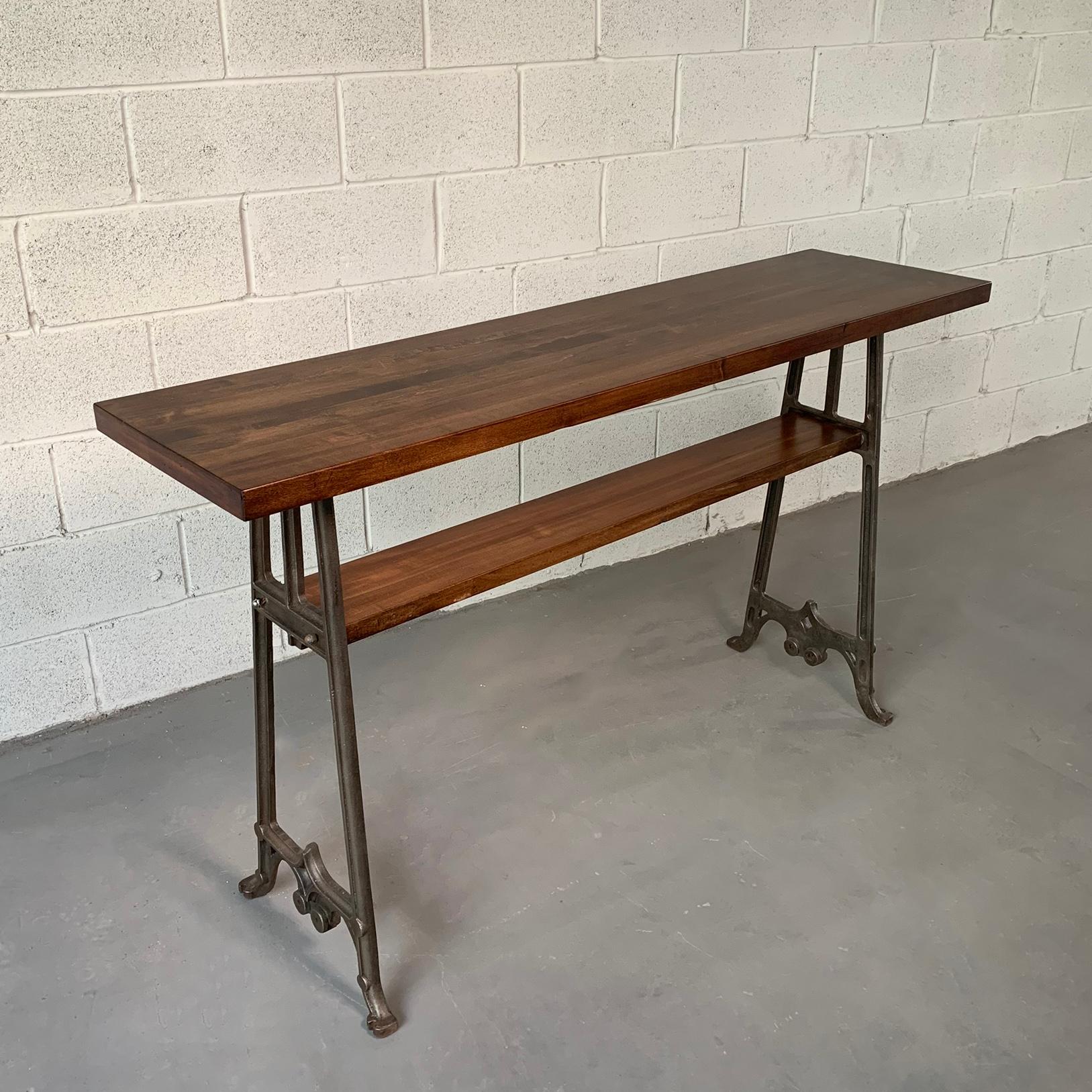 Custom, industrial console table featuring two tiers of reclaimed, stained maple block with early 20th century, Gothic, cast iron legs is made in Brooklyn by City Foundry for CF Signature Collection. Height of the bottom shelf is 23.5 inches.