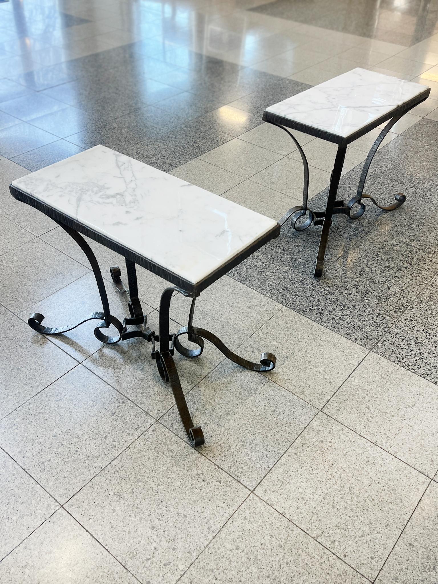 Newly made exclusively for Cafiero Select, these custom side tables consist of iron bases and white Carrara marble tops. The tables are directly inspired by the designs of René Drouet, particularly his wrought iron tables with their beautiful curled