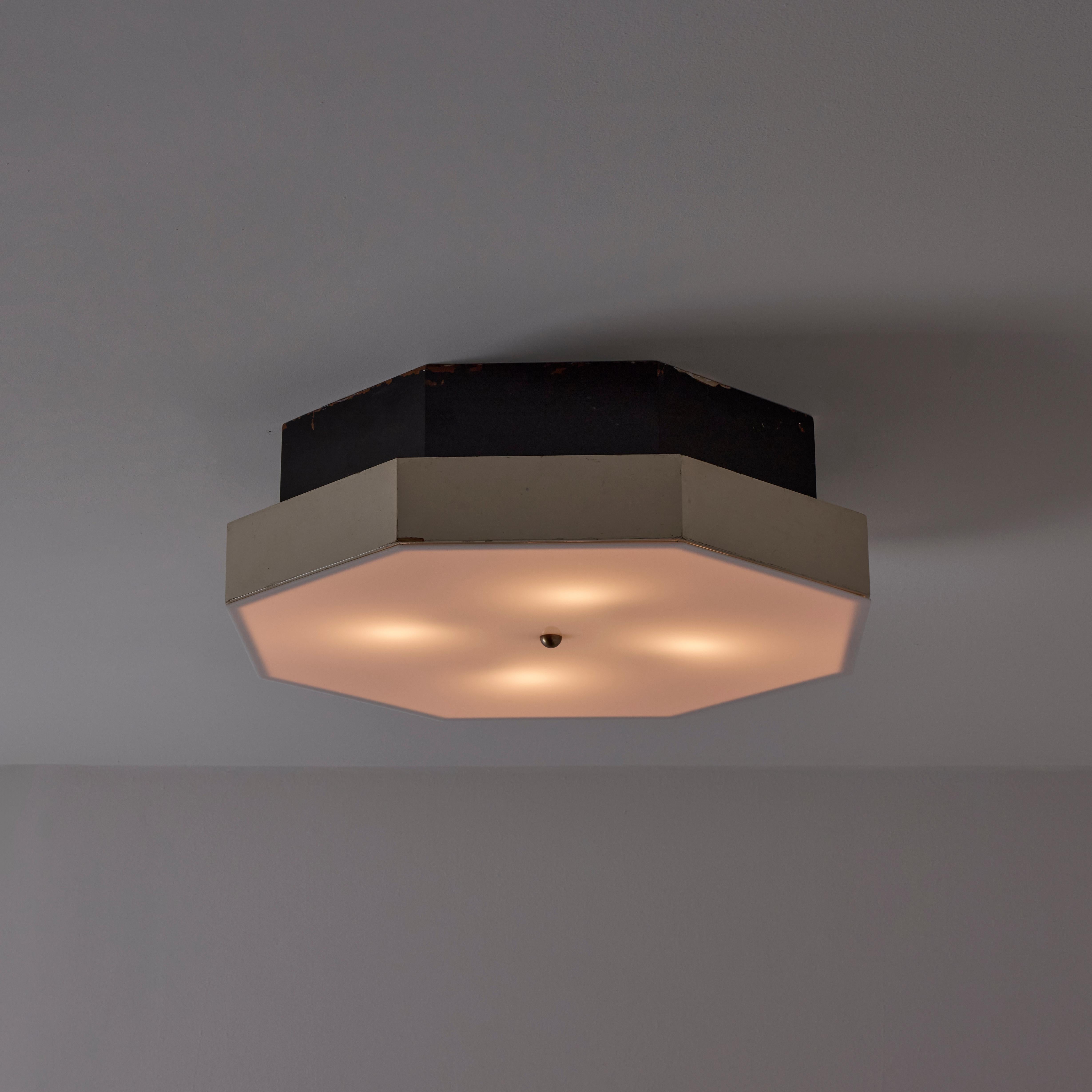 Custom Italian Ceiling Light (IT, 1960s)

Wooden hexagon paired with a lucite bottom diffuser. Black and cream colored enameled finish on the wood elements. The lamping consists of four E26 socket-types. We recommend a 40-60w max bulb or LED