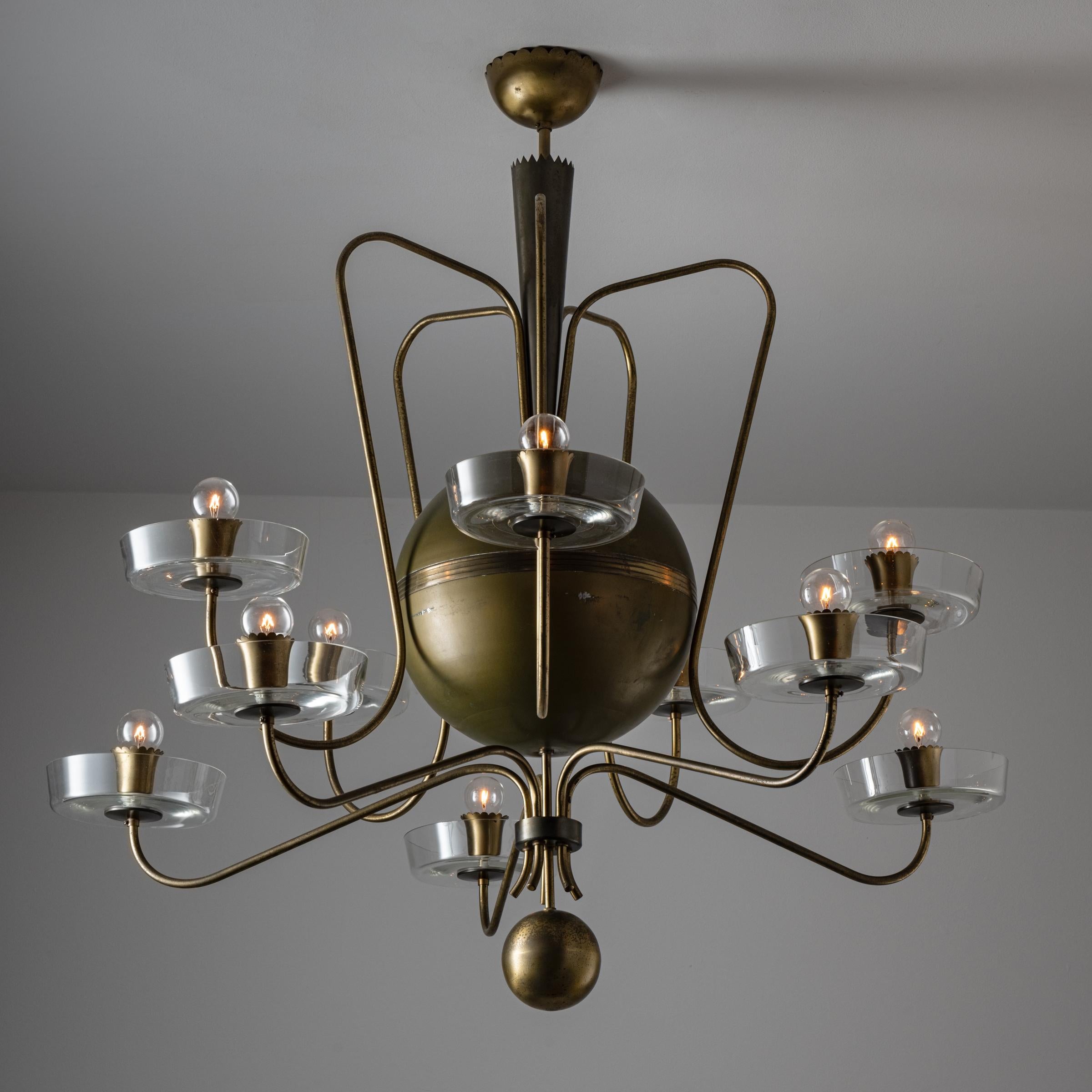 Custom Italian chandelier. Designed and manufactured in Italy, circa 1940's Brass, glass, original brass canopy, custom brass backplate. Rewired for U.S standards. Lamping: Allow 10 qty 120v E14 Candelabra Socket with 25w Clear Globes. Light bulbs