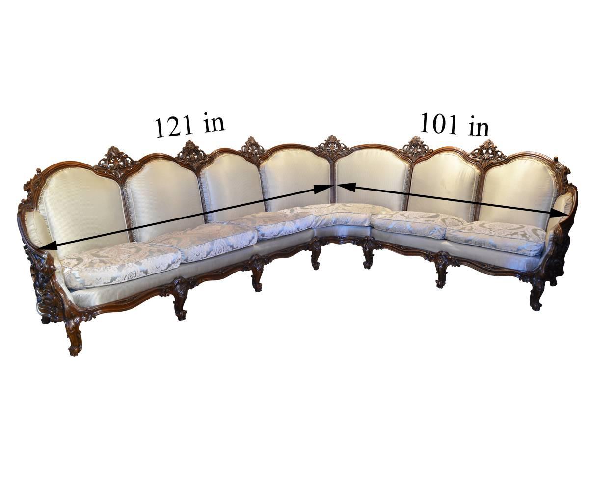 Wow! We have never seen a sectional set like this one leading us to believe it was custom made for a specific buyer sometimes in the 1920s or so. The set consists of a sectional that comfortably seats seven and two chairs. The sectional is actually