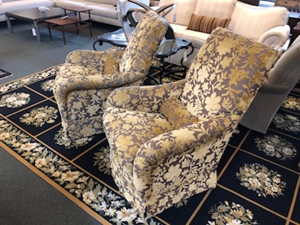 A glamorous pair of armchairs, dressed to the nines in Fadini Borghi fabric. Created by J. F. Fitzgerald Furniture, San Francisco, the rich gold velvet stands out against the rich, gray background. Gently rocks and swivels in comfort. Extra fabric