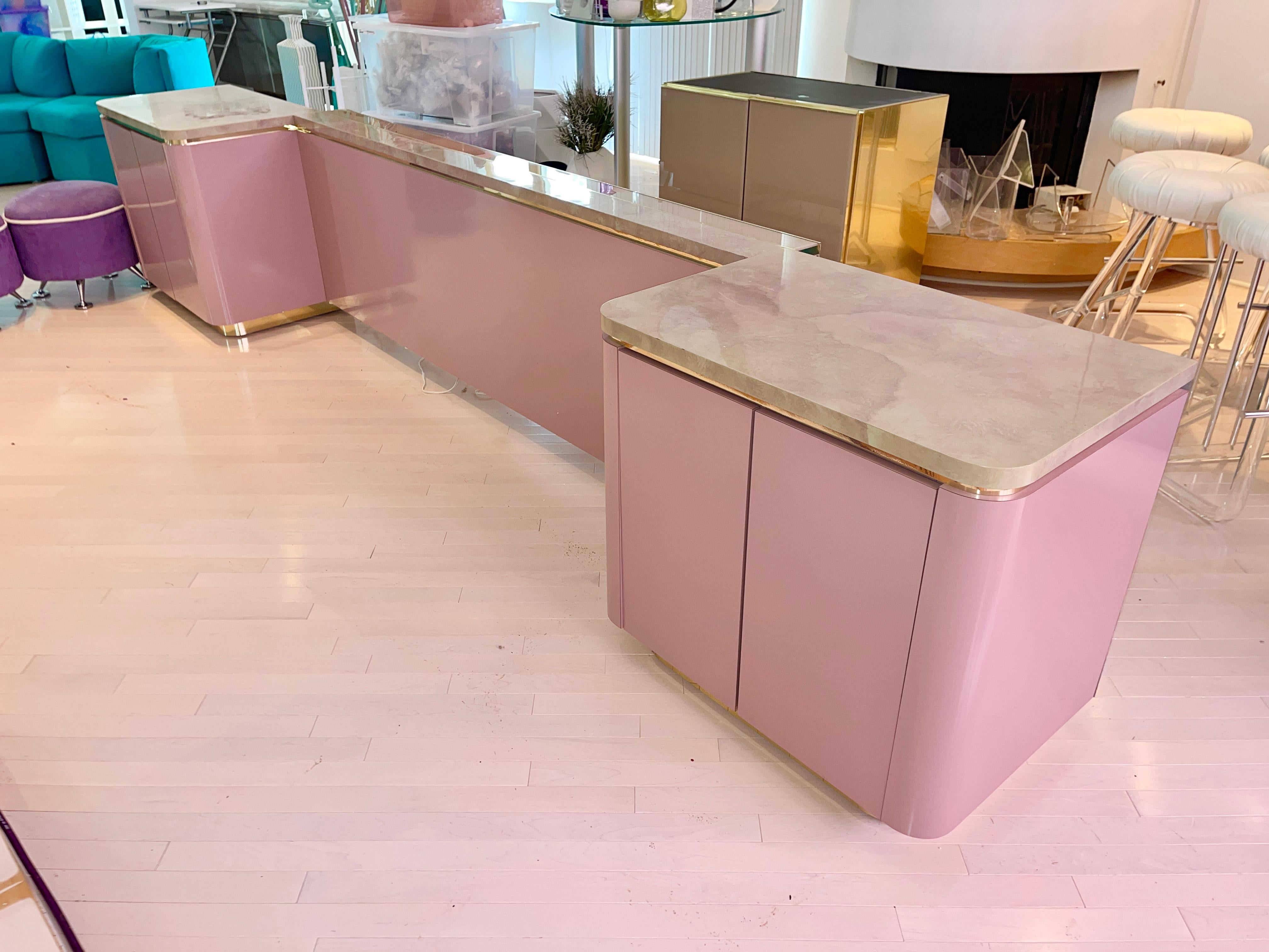 SATURDAY SALE

Vintage 1980 custom cabinet King headboard with integrated nightstands quality construction hardwood clad in pinkish mauve fushia magenta Formica laminate and brass trim and brass recessed plinth.
Finished on backside with mirrored