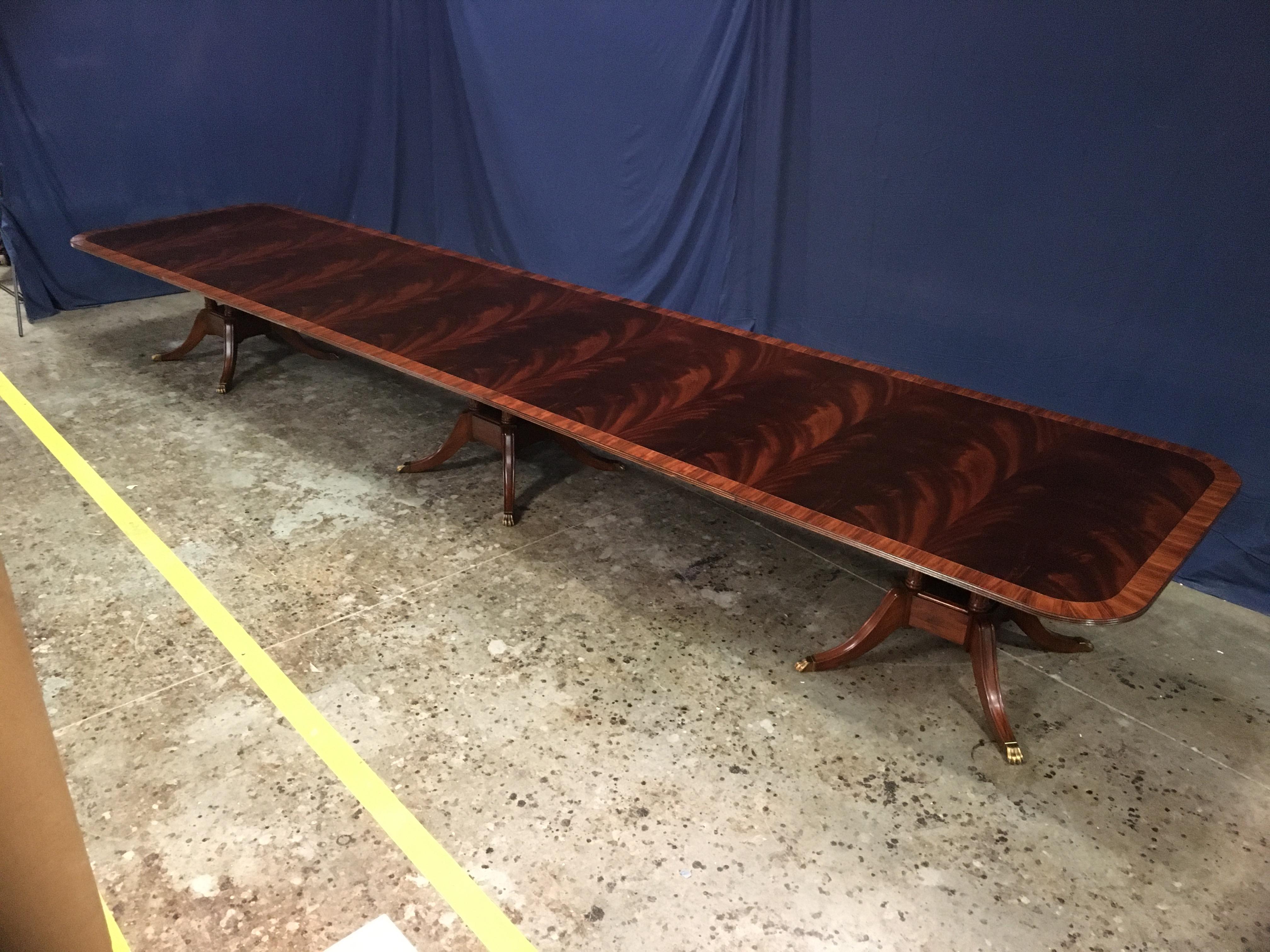 This is a made-to-order large traditional mahogany banquet/dining table made in the Leighton Hall shop. It features a field of slip-matched swirly crotch mahogany from West Africa and a Santos Rosewood border. It has a hand rubbed and polished